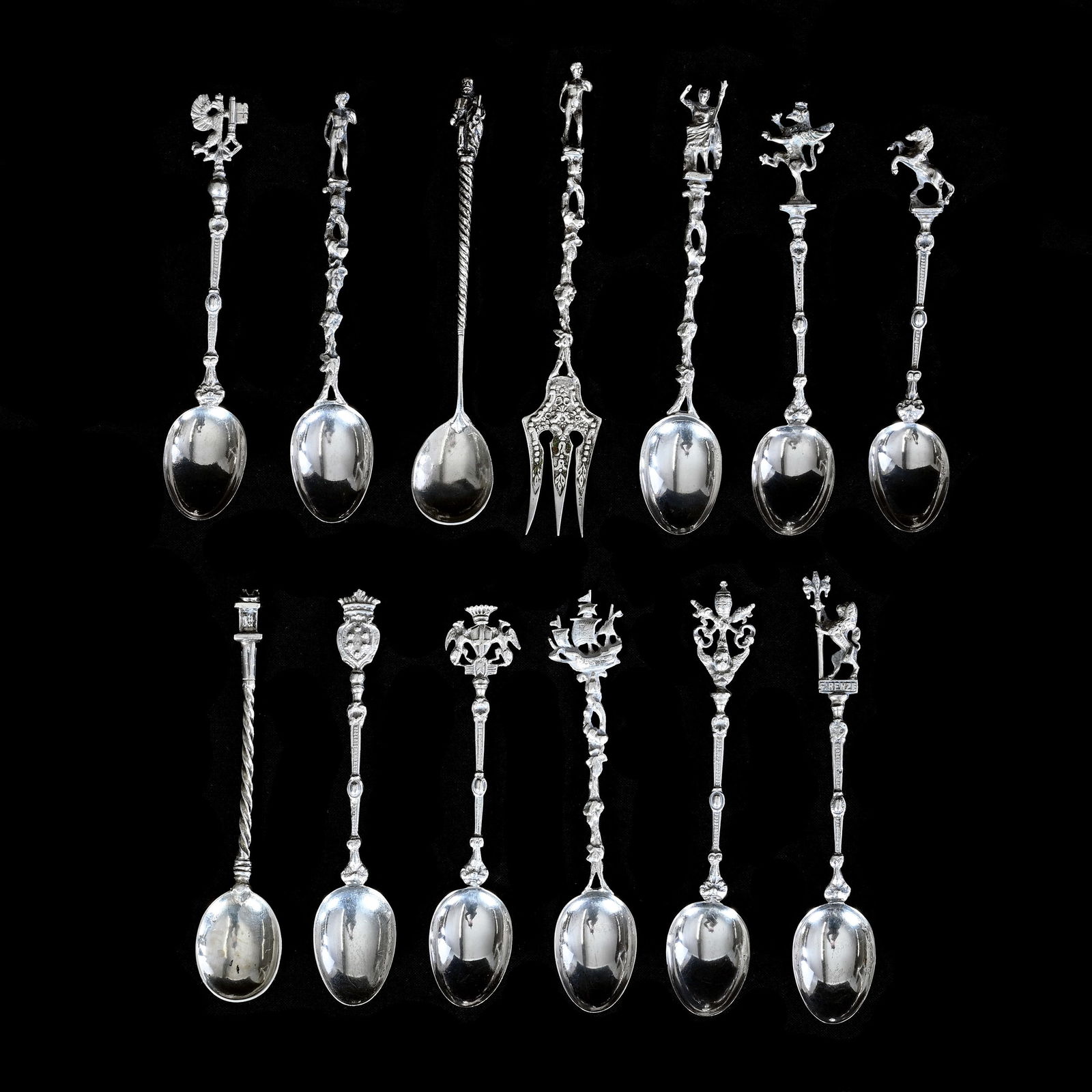 (13) Figural Handled Teaspoons, Coin Silver: (13) Figural Handled Teaspoons, Coin Silver Various Figures Such As Rampant Lion, Statue, And Crest Designs, One Is Missing Figure, Average Size Is 4.75", 170 Grams, Colorado Private Collection.