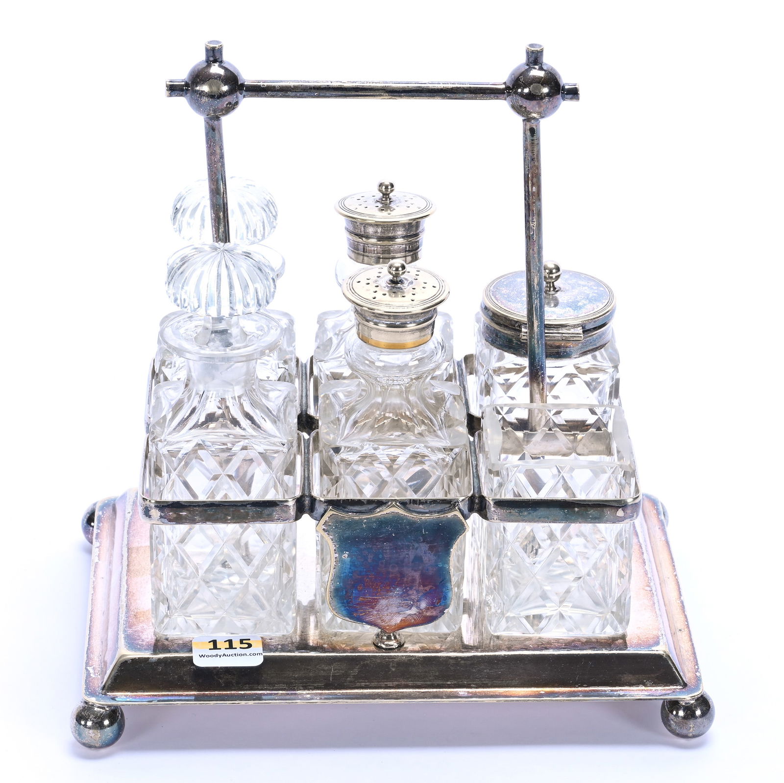 Condiment Set, English: Condiment Set, English, 8.25 x 8 x 6 Inches, (6) Square Bottles Set On Silverplate Frame, One Bottle Has Been Cut Down, 4 Pounds, Colorado Private Collection.