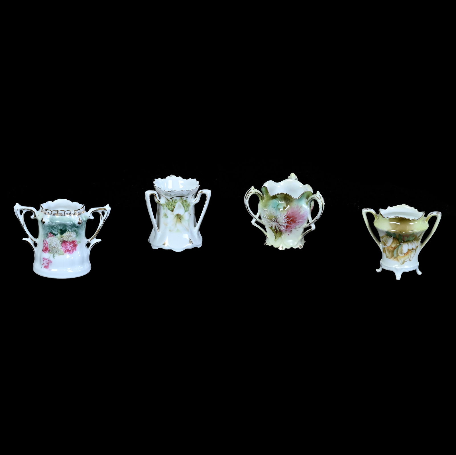 (4) R.S. Prussia Toothpick Holders: (4) R.S. Prussia Toothpick Holders, All Are Approximate 2.25", (2) Three Handled, (2) Two Handled, Two Are Marked, Various Colors And Patterns, Three Handled Easter Lily Has A Small Rim Chip, 0.4 Poun