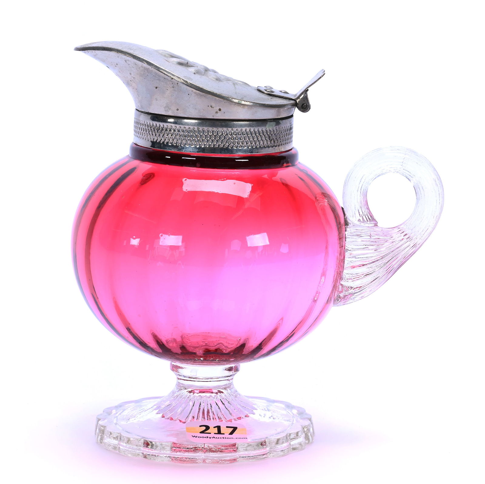 Pedestal Syrup, Cranberry Art Glass: Pedestal Syrup, Cranberry Art Glass, 6 x 5.25 x 4 Inches, Optic Rib With Clear Applied Foot And Handle, Nickel Metal Flip Lid, 1 Pound, Grady And Annette Hite Collection.