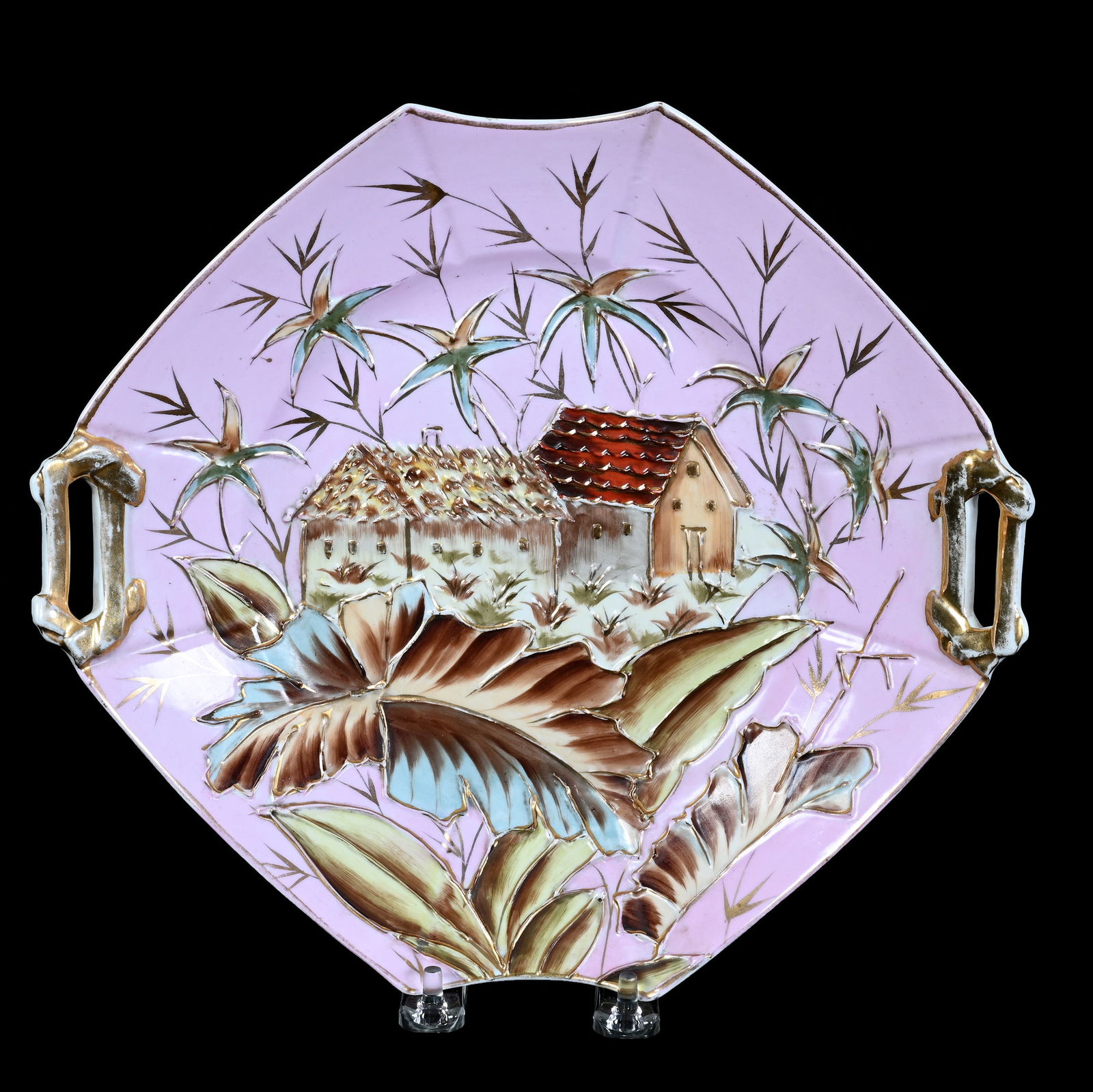 Two Handled Cake Plate, Early Unmarked Prussia: Two Handled Cake Plate, Early Unmarked Prussia, 11 x 10 x 2 Inches, Pink Background With Raised Tropical Village Scenic Decor, Gold Highlights, 1.6 Pounds, Grady And Annette Hite Collection.