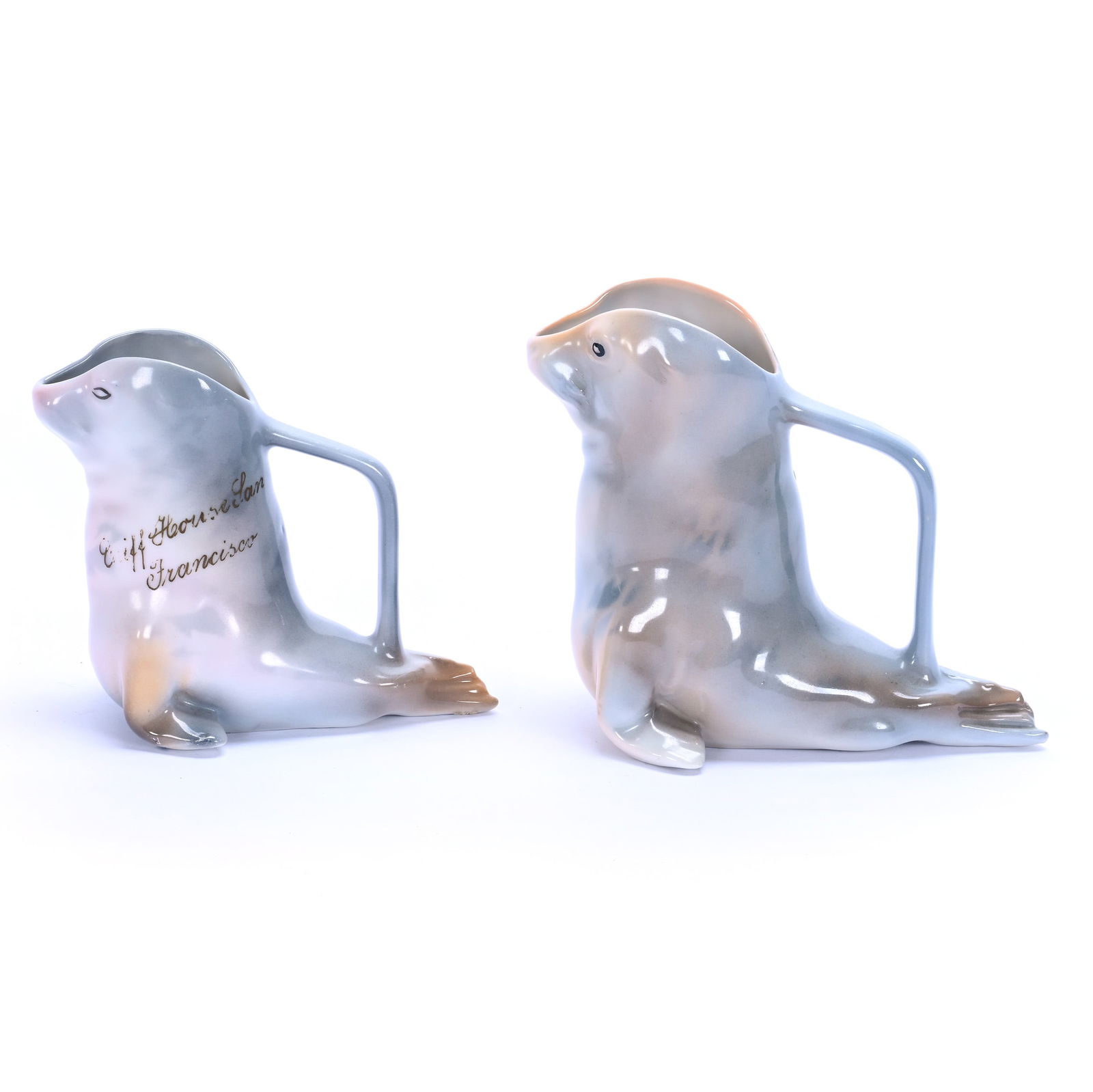 Royal Bayreuth Figural Milk And Creamer: Royal Bayreuth Figural Milk And Creamer Seal, (1) 4.75" x 5.75" Milk With Blue Mark, (1) 4" x 4.75" x 2.75" Creamer, Unmarked Souvenir Of San Francisco, 0.6 Pounds, Grady And Annette Hite Collection.