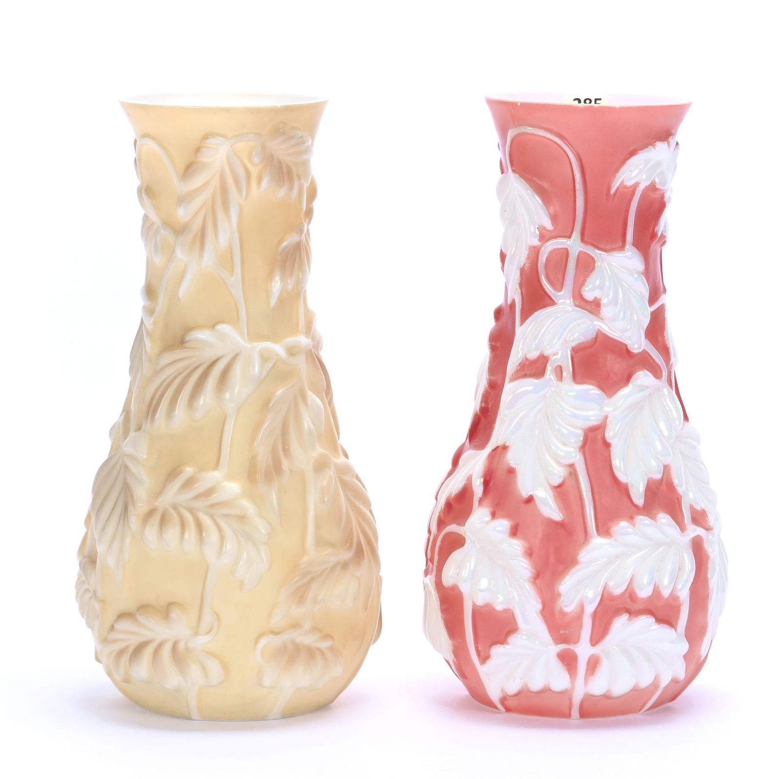 (2) Vases, Phoenix Art Glass, Philodendron Pattern: (2) Vases, Phoenix Art Glass, Philodendron Pattern, 11.5 x 5.75 x 5.75 Inches, (1) Pink Background With Pearlescent Leaves, (2) Yellow Background With Brown Leaves, 5.7 Pounds, Grady And Annette Hite