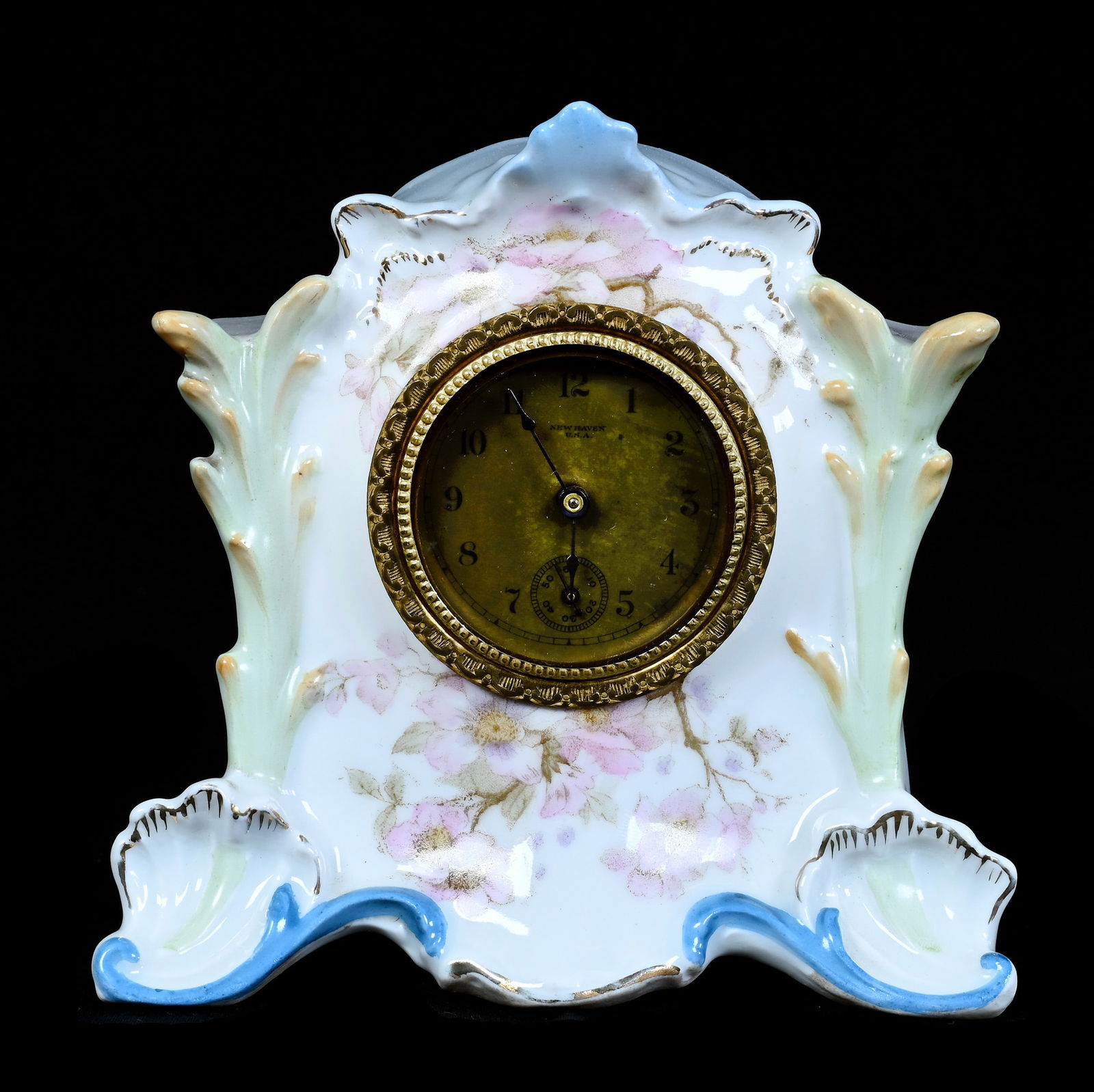 Clock, Unmarked R.S. Prussia: Clock, Unmarked R.S. Prussia, 5.5 x 5.5 x 2.25 Inches, Blue And White Tones With Pink Floral Decor, Unusual Mold, New Haven Clockworks, 1 Pound, Grady And Annette Hite Collection.