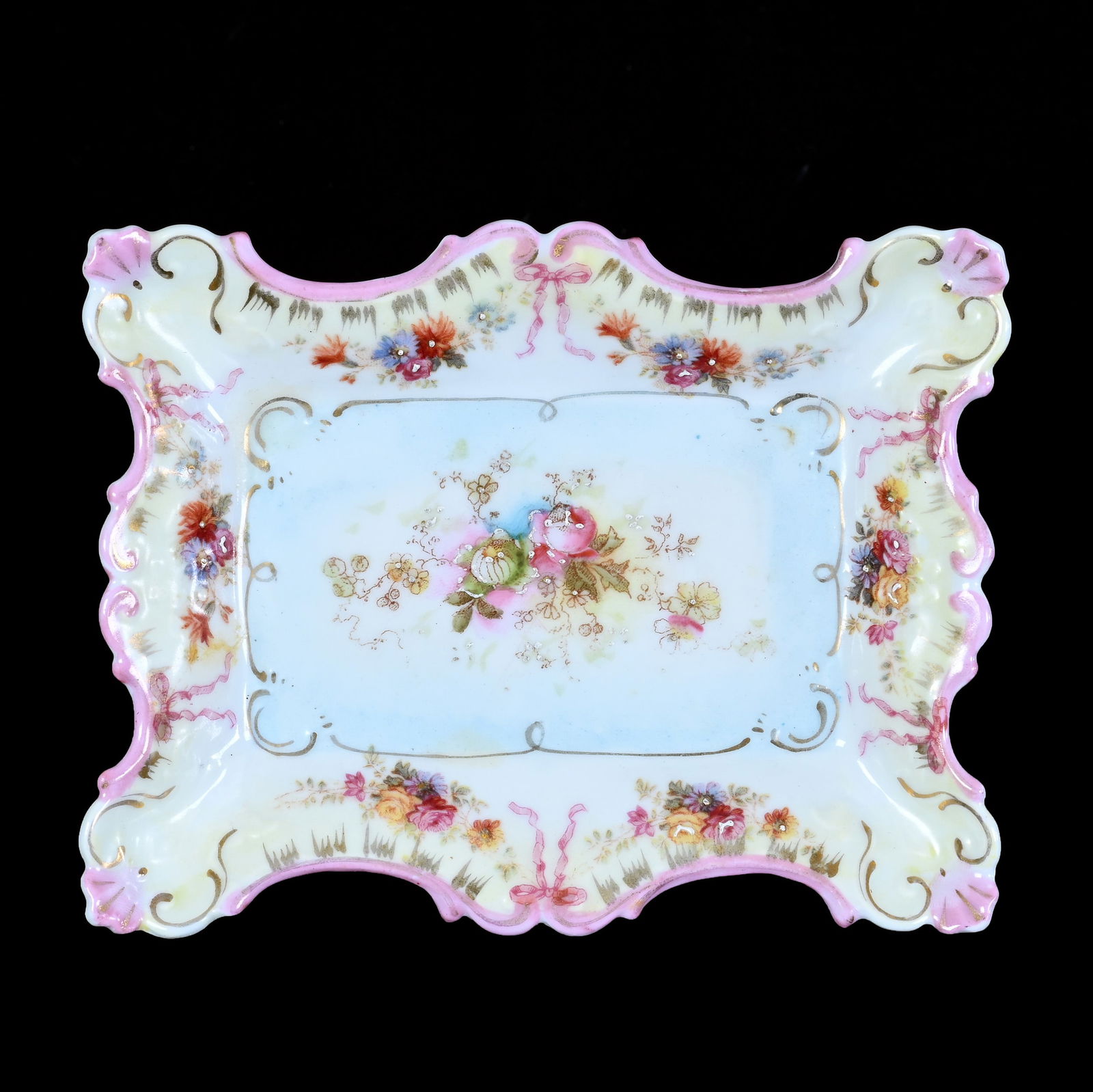 Footed Pin Tray, Unmarked R.S. Prussia: Footed Pin Tray, Unmarked R.S. Prussia, 5 x 4 x 1.5 Inches, Blue, Yellow And Pink Tones, Floral And Bowtie Decor, 0.2 Pounds, Grady And Annette Hite Collection.
