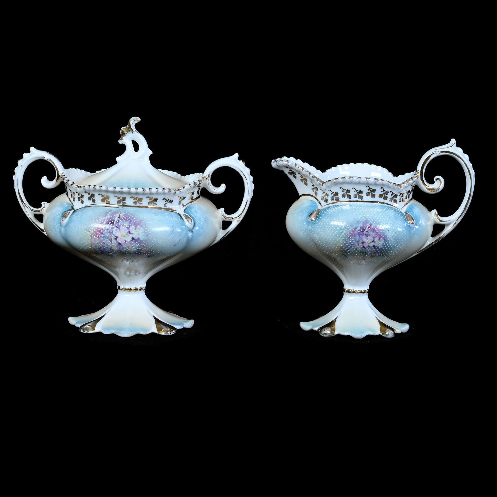 Pedestal Creamer & Sugar Set Marked R.S. Prussia: Pedestal Creamer & Sugar Set Marked R.S. Prussia, 4.75 x 5.5 x 4 Inches, Blue, Yellow And White Tones, Violet Decor, White Enamel Tapestry Finish, 0.7 Pounds, Grady And Annette Hite Collection.