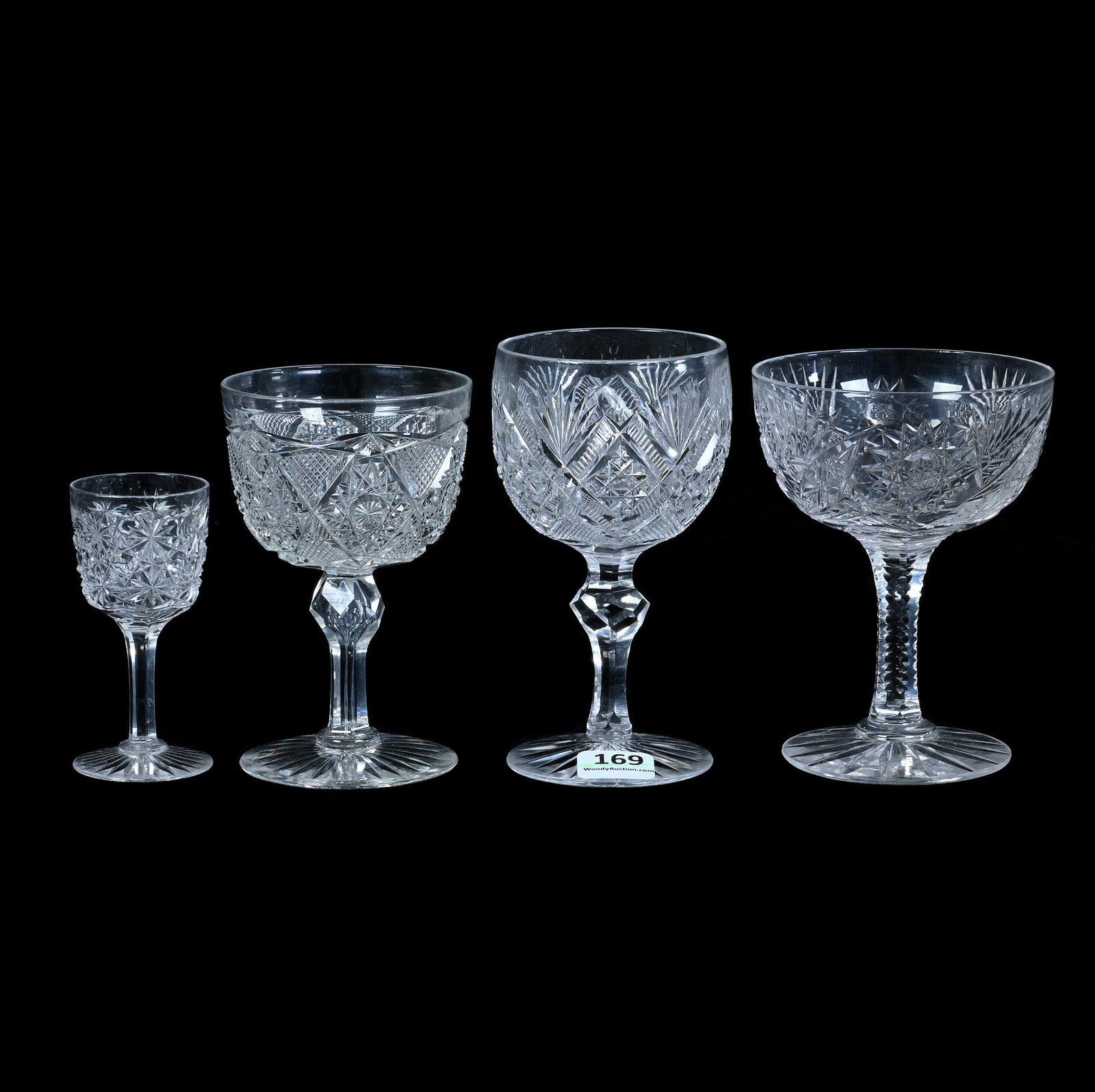 (4) Stems, American Brilliant Cut Glass: (4) Stems, American Brilliant Cut Glass, (1) 5" x 2.75" Wine, Hobstar, Zipper, And Fan Motif, (1) 4.5" x 2.75" Wine, Niagara Pattern By Pitkin & Brooks, (1) 4.5" x 3.5" Saucer Champagne, Delmar Patter
