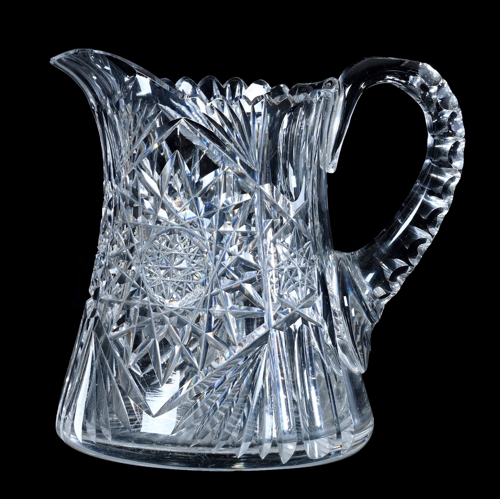Water Pitcher, American Brilliant Cut Glass: Water Pitcher, American Brilliant Cut Glass, 6.75 x 7 x 5.25 Inches, Hobstar, Long Thumbprint, And Fan Motif, Ray Cut Base, Double Notched Handle, Hard To See Handle Annealing Flaw, Spout Chips, 3.6 P