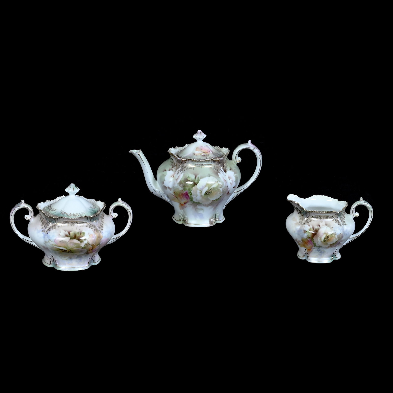 (3) Piece Tea Set, Marked R.S. Prussia: (3) Piece Tea Set, Marked R.S. Prussia, 5.5 x 8 x 5 Inches, Green And White Satin Finish With White Poppy Decor, Teapot With Creamer And Sugar, 1.4 Pounds. LiveAuctioneers Invoices Must Be Paid Using 