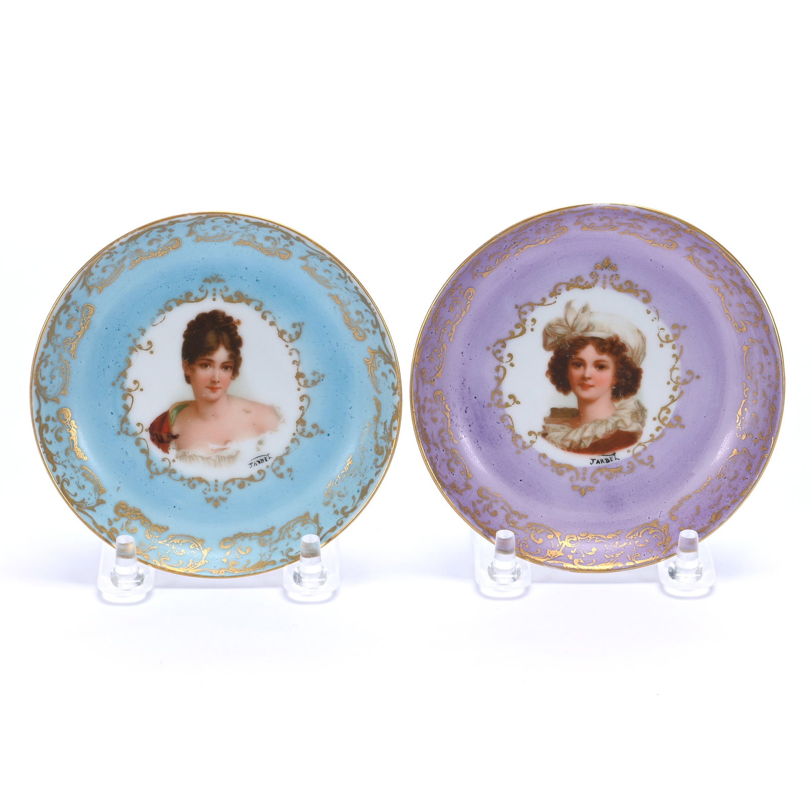 (2) Dishes: (2) Dishes, 4 x 4 x 0.75 Inches, (1) Lavender With Lebrun With Hat Portrait, Marked Germany, (1) Blue With Recamier Portrait, Beehive Mark, 0.3 Pounds. LiveAuctioneers Invoices Must Be Paid Using the