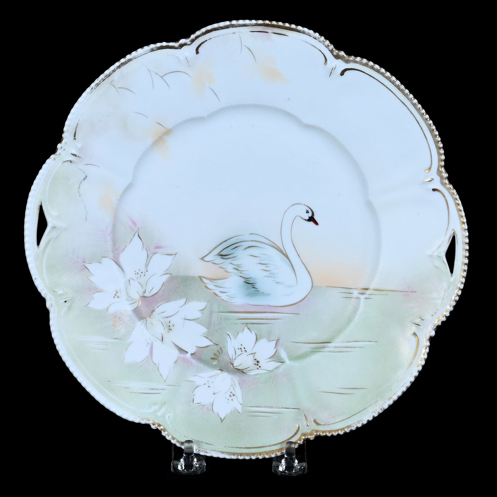 Two Handled Cake Plate, Marked R.S. Prussia: Two Handled Cake Plate, Marked R.S. Prussia, 9.75 x 9.75 x 1 Inches, Green And White Satin Finish With Stylized Swan Scenic Decor, Some Gold Trim Wear, 0.7 Pounds. LiveAuctioneers Invoices Must Be
