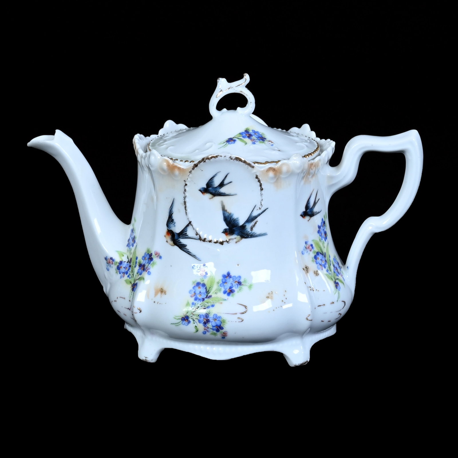 Teapot, Marked R.S. Prussia, Medallion Mold: Teapot, Marked R.S. Prussia, Medallion Mold, 5.5 x 7.75 x 5 Inches, Peach And White Luster Finish With Bluebird And Water Lily Decor, Secondary Blue Floral Highlights, 0.9 Pounds. LiveAuctioneers