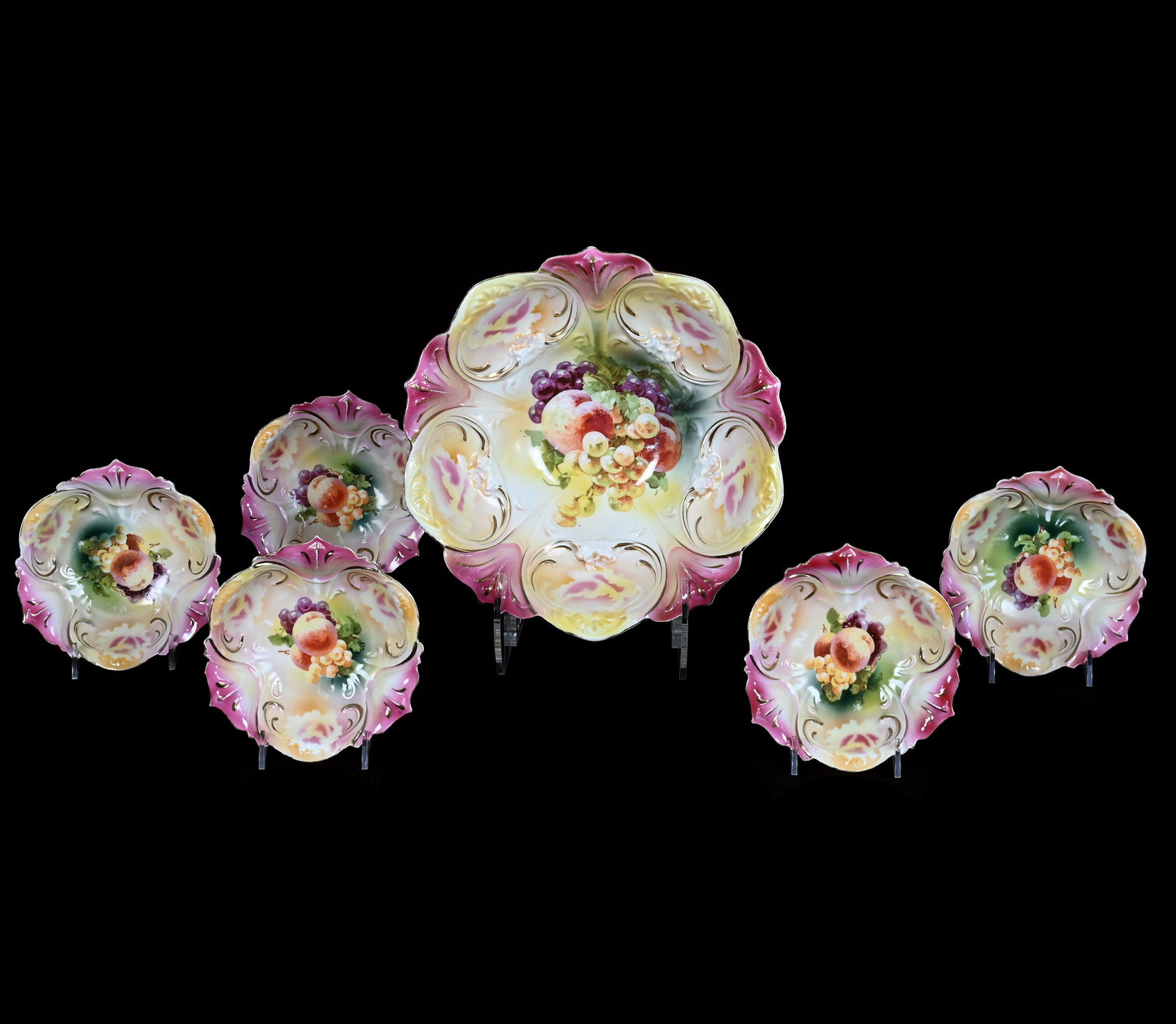 Berry Set, Marked R.S. Prussia: Berry Set, Marked R.S. Prussia, 10.5 x 10.5 x 3.5 Inches, Pink And Yellow Tones With Fruit Decor, (5) 5.75" Berry Bowls, 2.8 Pounds. LiveAuctioneers Invoices Must Be Paid Using the PAY NOW / CHECK