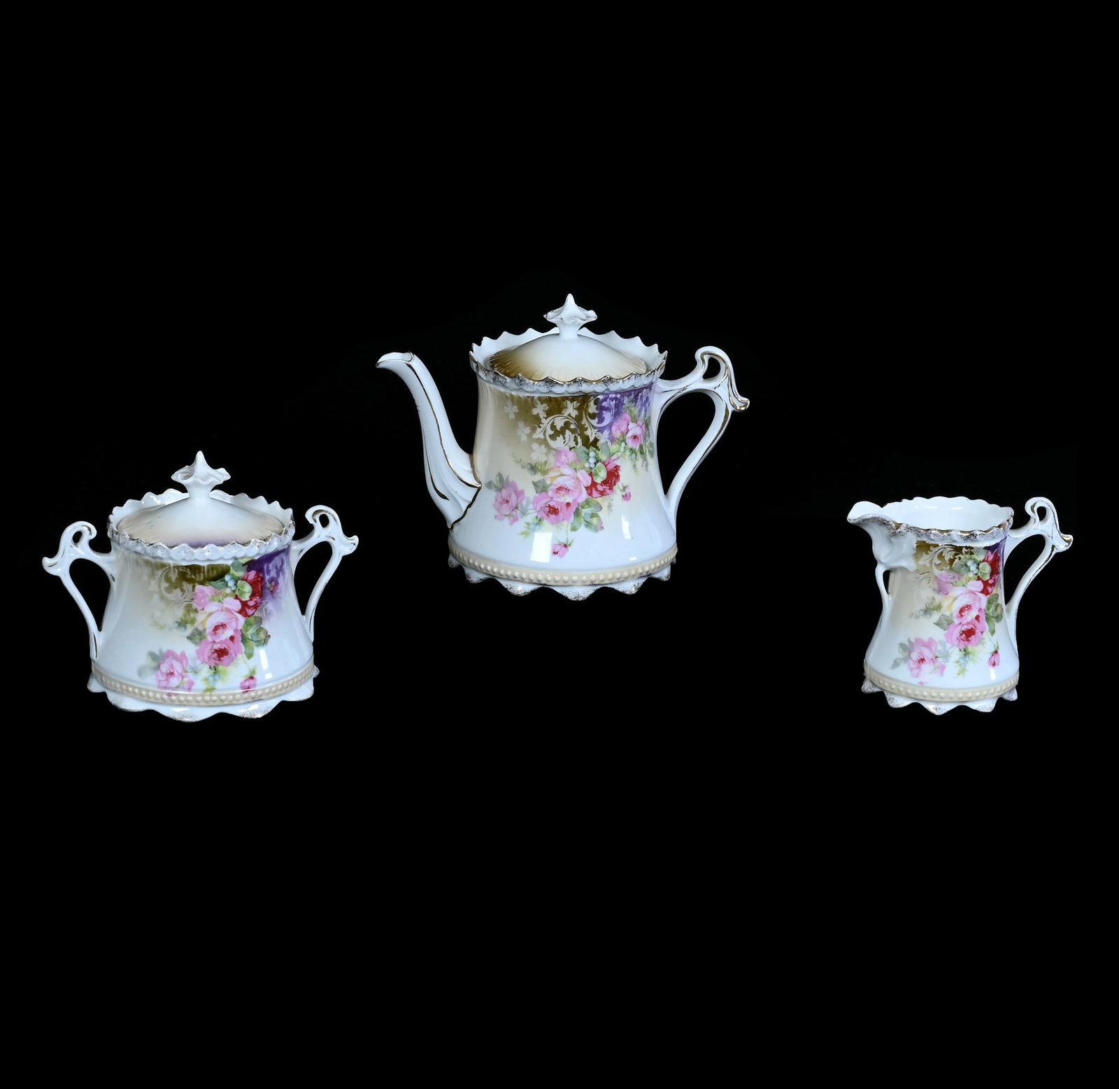 (3) Piece Tea Set, Marked R.S. Prussia: (3) Piece Tea Set, Marked R.S. Prussia, 5.25 x 7 x 4.25 Inches, Cream, White, And Green Tones With Pink Rose Decor, Teapot With Creamer And Sugar, 1.4 Pounds. LiveAuctioneers Invoices Must Be Paid Usi