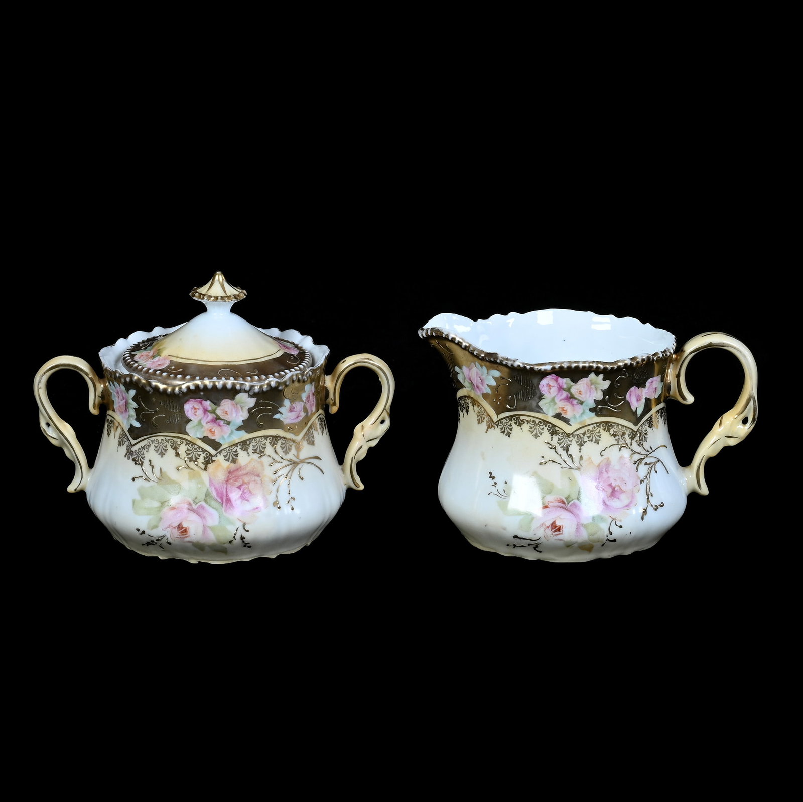 Creamer And Sugar, Unmarked R.S. Prussia: Creamer And Sugar, Unmarked R.S. Prussia, 4 x 5.25 x 3.5 Inches, Cream And White With Pink Rose Decor And Heavy Gold Border, 0.8 Pounds. LiveAuctioneers Invoices Must Be Paid Using the PAY NOW / CHECK