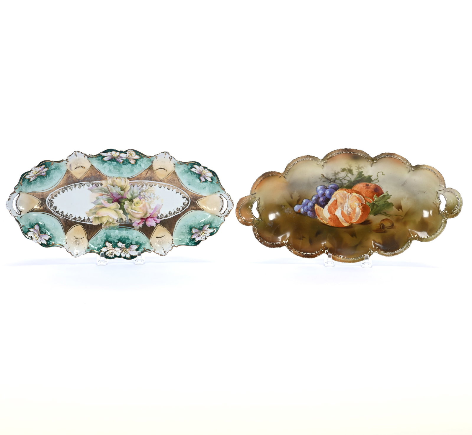 (2) Celery Trays, Unmarked R.S. Prussia: (2) Celery Trays, Unmarked R.S. Prussia, 12 x 6.25 x 1.75 Inches, (1) Brown Tones With Fruit Decor, (1) Green And Cream Tones With Yellow Rose Decor, 1.3 Pounds. LiveAuctioneers Invoices Must Be Paid 