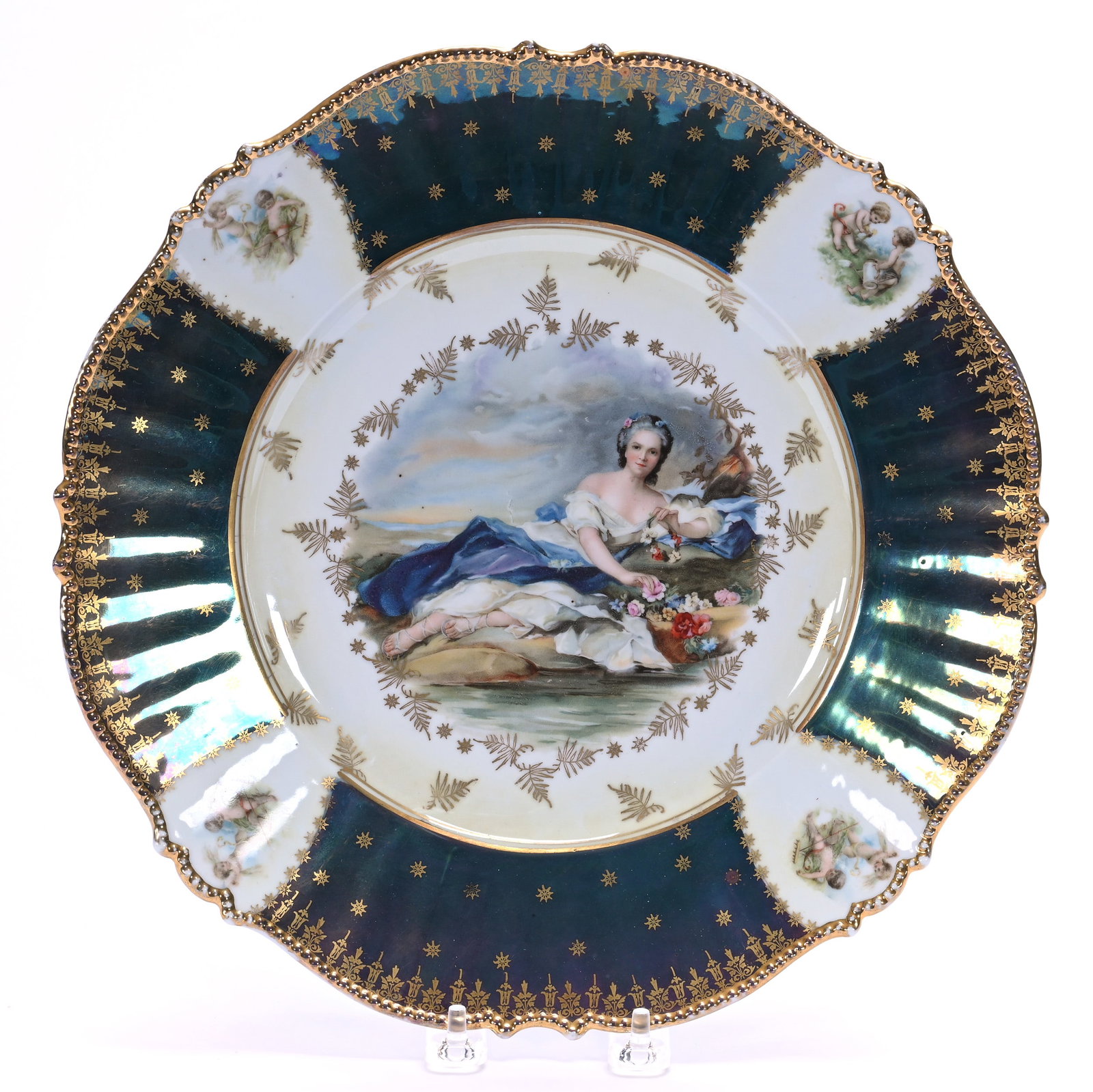 Plate, Unmarked R.S. Prussia, Mold 343: Plate, Unmarked R.S. Prussia, Mold 343, 12 x 12 x 1.75 Inches, Flora Scenic Decor With Cherub Medallions, Iridescent Tiffany Border, Strong Gold Highlights, 1.7 Pounds. LiveAuctioneers Invoices Must B
