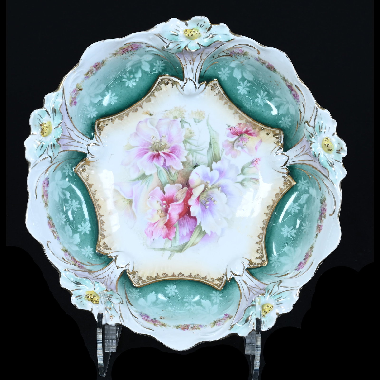 Bowl, Crown Mark Prussia, Lily Mold: Bowl, Crown Mark Prussia, Lily Mold, 10.5 x 10.5 x 3 Inches, Cream And White Center With Floral Decor, Green Border With Lavender Highlights, Two Small Surface Rim Nicks, 1.1 Pounds. LiveAuctioneers
