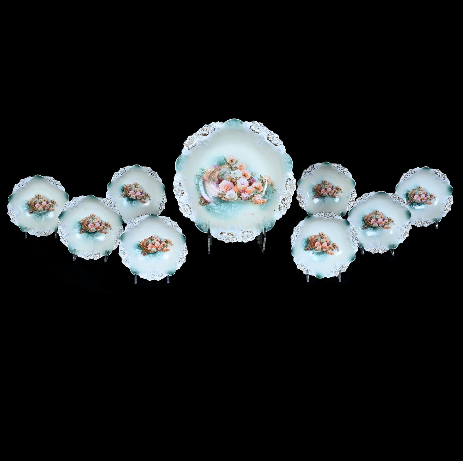 Berry Set, Unmarked R.S. Prussia, Icicle Mold: Berry Set, Unmarked R.S. Prussia, Icicle Mold, 10.5 x 10.5 x 2.75 Inches, Green And Yellow Tones With Spilled Basket Decor, (8) 5.5" Berry Bowls, 3.5 Pounds. LiveAuctioneers Invoices Must Be Paid