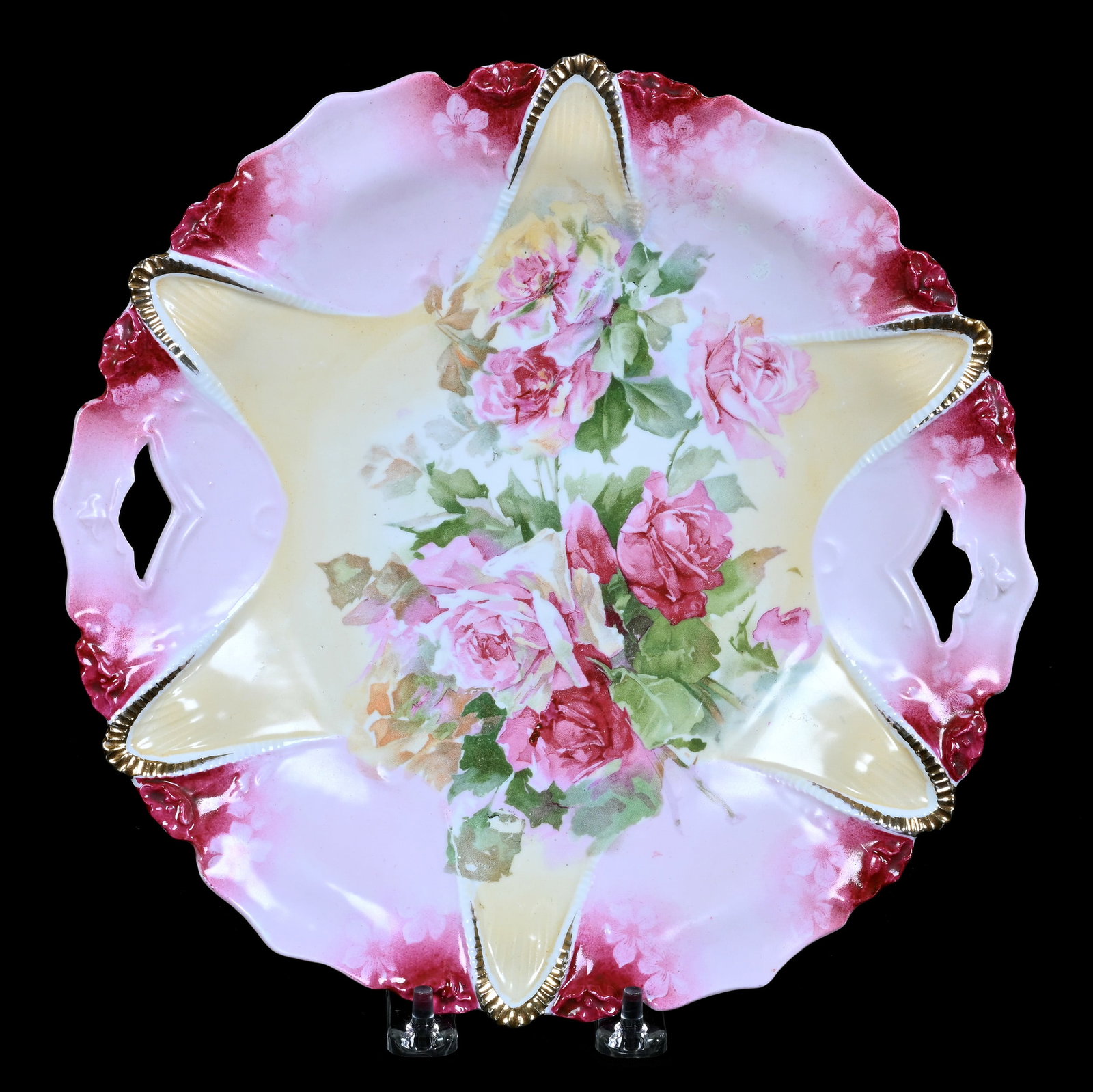 Two Handled Cake Plate, Marked R.S. Prussia: Two Handled Cake Plate, Marked R.S. Prussia, 10.25 x 10.25 x 1.25 Inches, Cream, Pink, And Red Tones With Pink Rose Decor, Faint Mark, 0.8 Pounds. LiveAuctioneers Invoices Must Be Paid Using the PAY