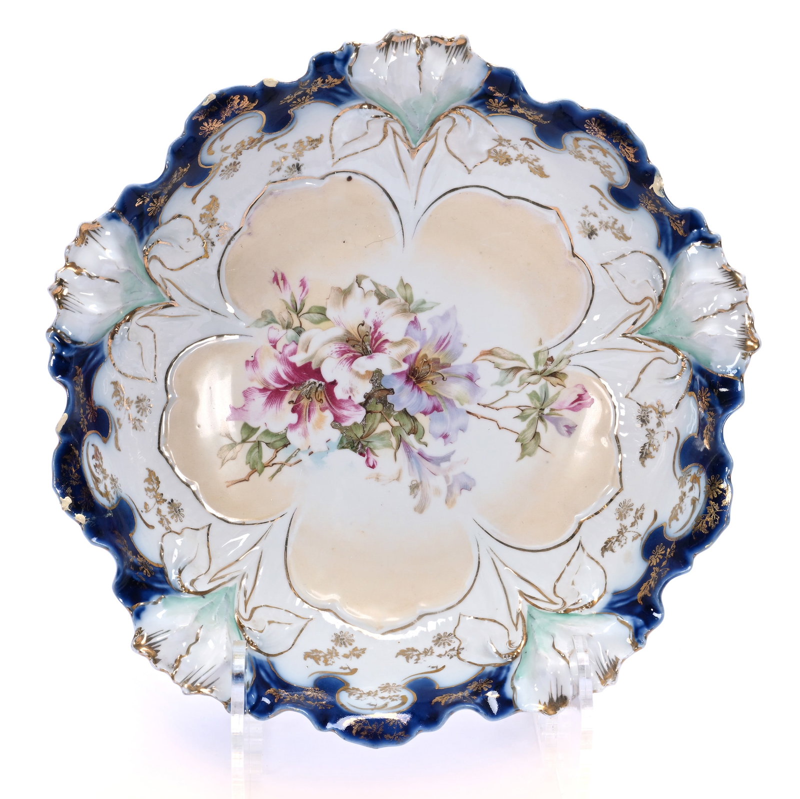 Bowl, Unmarked R.S. Prussia, Iris Mold: Bowl, Unmarked R.S. Prussia, Iris Mold, 10 x 10 x 2.75 Inches, Cream Center With Cobalt Blue And White Border, Floral Decor, Hairline And White Enamel Paint On Rim, 1.1 Pounds. LiveAuctioneers
