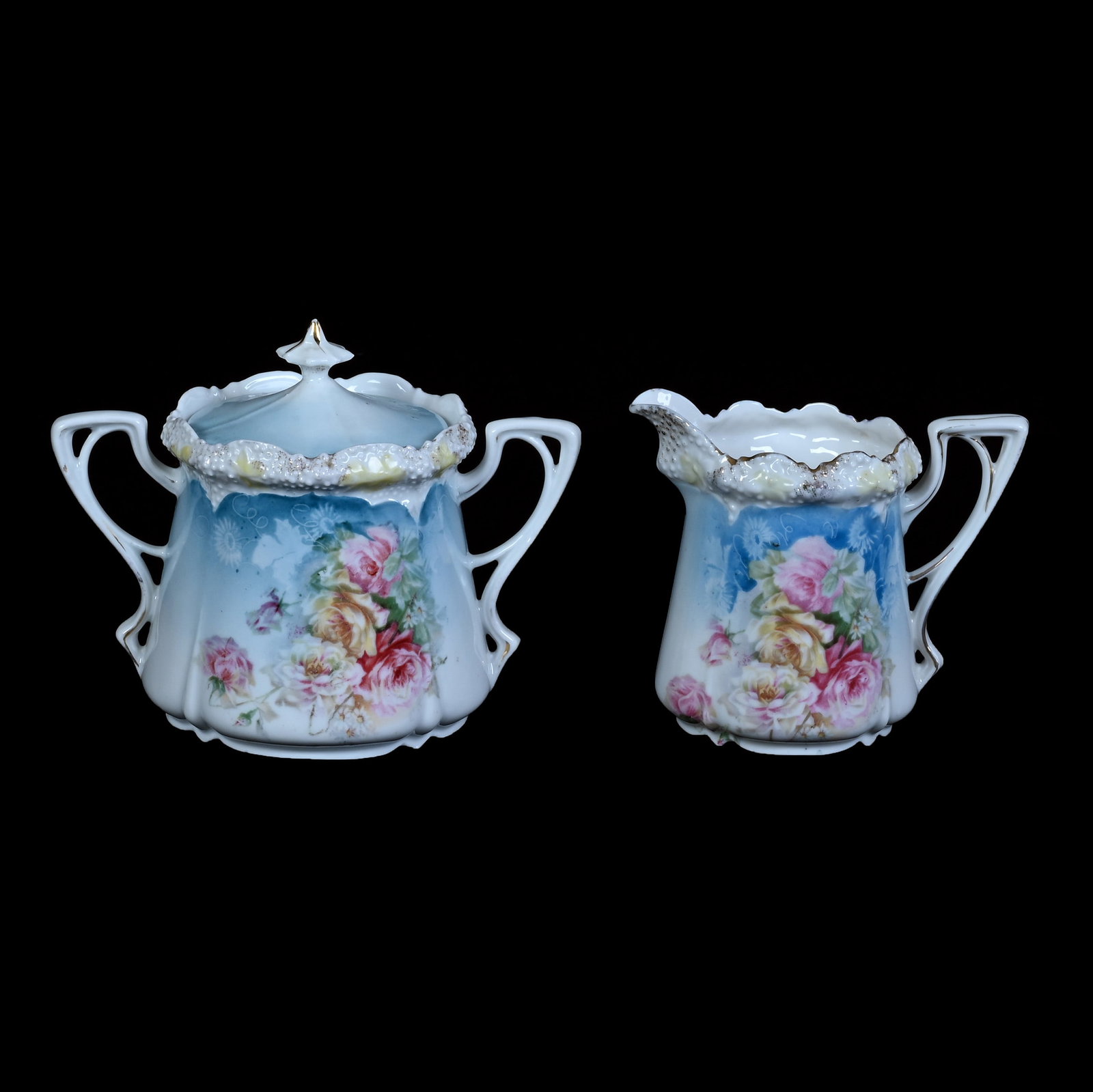 Creamer And Sugar, Marked R.S. Prussia, Stipple Mold: Creamer And Sugar, Marked R.S. Prussia, Stipple Mold, 4.25 x 5.5 x 3.75 Inches, Blue And White Tones With Rose Decor, 0.8 Pounds. LiveAuctioneers Invoices Must Be Paid Using the PAY NOW / CHECK OUT