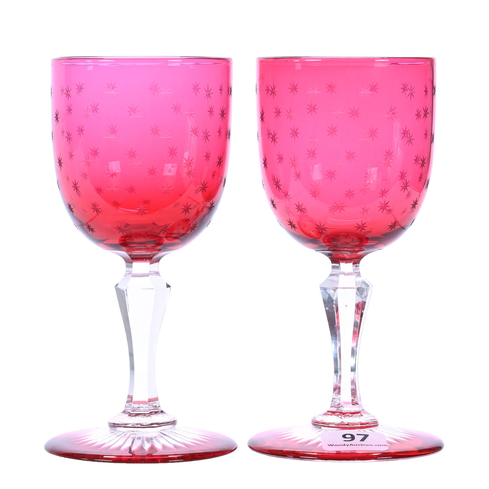 (2) Wine Stems, American Brilliant Cut Glass, Cased Cranberry With Engraved Star Highlights: (2) Wine Stems, American Brilliant Cut Glass, Cased Cranberry With Engraved Star Highlights, 5.25 x 2.75 x 2.75 Inches, Colored Ray Cut Foot, Attributed To Dorflinger, 1 Pounds, Private Collection.