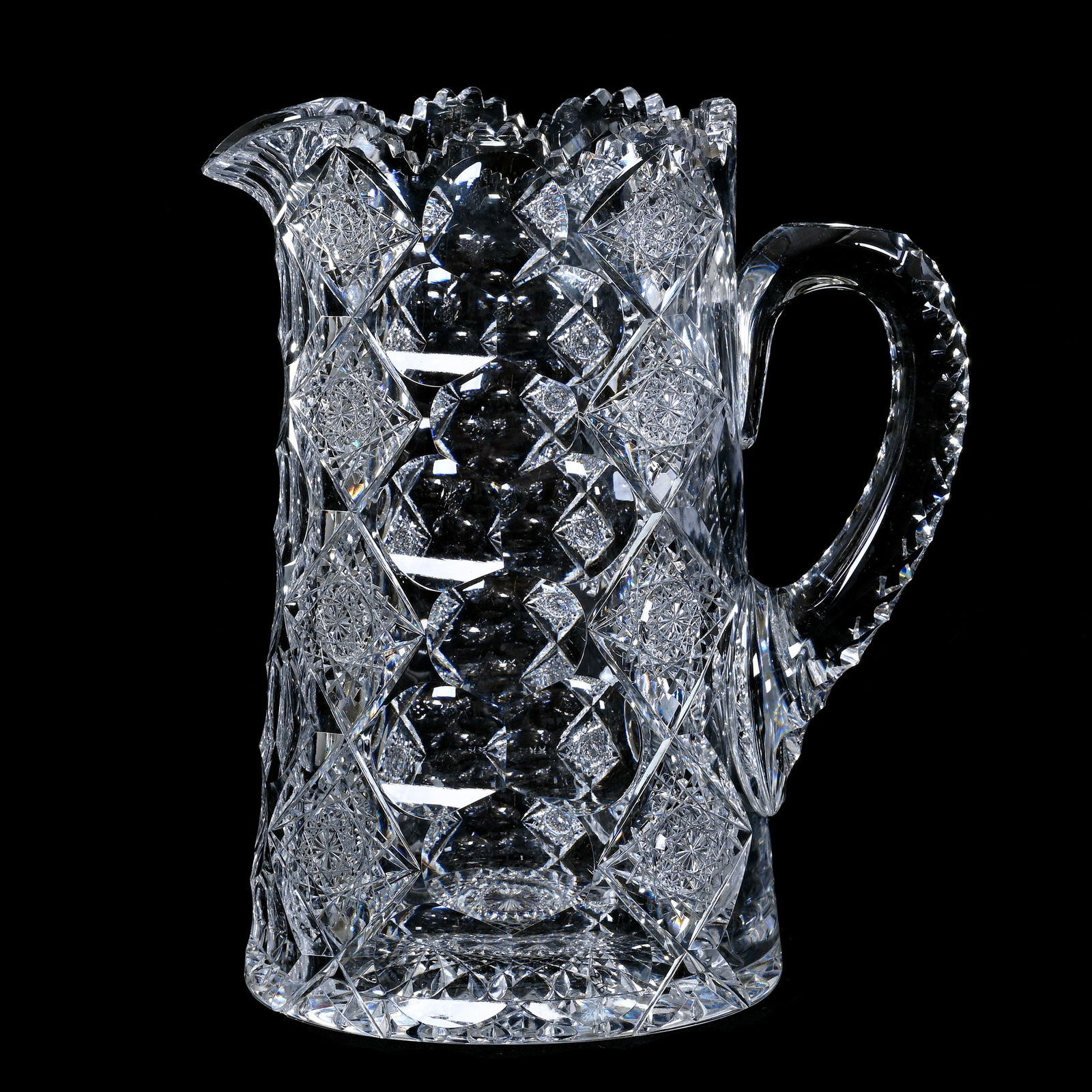 Pitcher, American Brilliant Cut Glass, Signed Hawkes Queens Pattern: Pitcher, American Brilliant Cut Glass, Signed Hawkes Queens Pattern, 8.75 x 7.5 x 5 Inches, Triple Notched Handle, Hobstar Base, Base Nick, 5 Pounds, Judy Ratcliffe Collection, Florida.