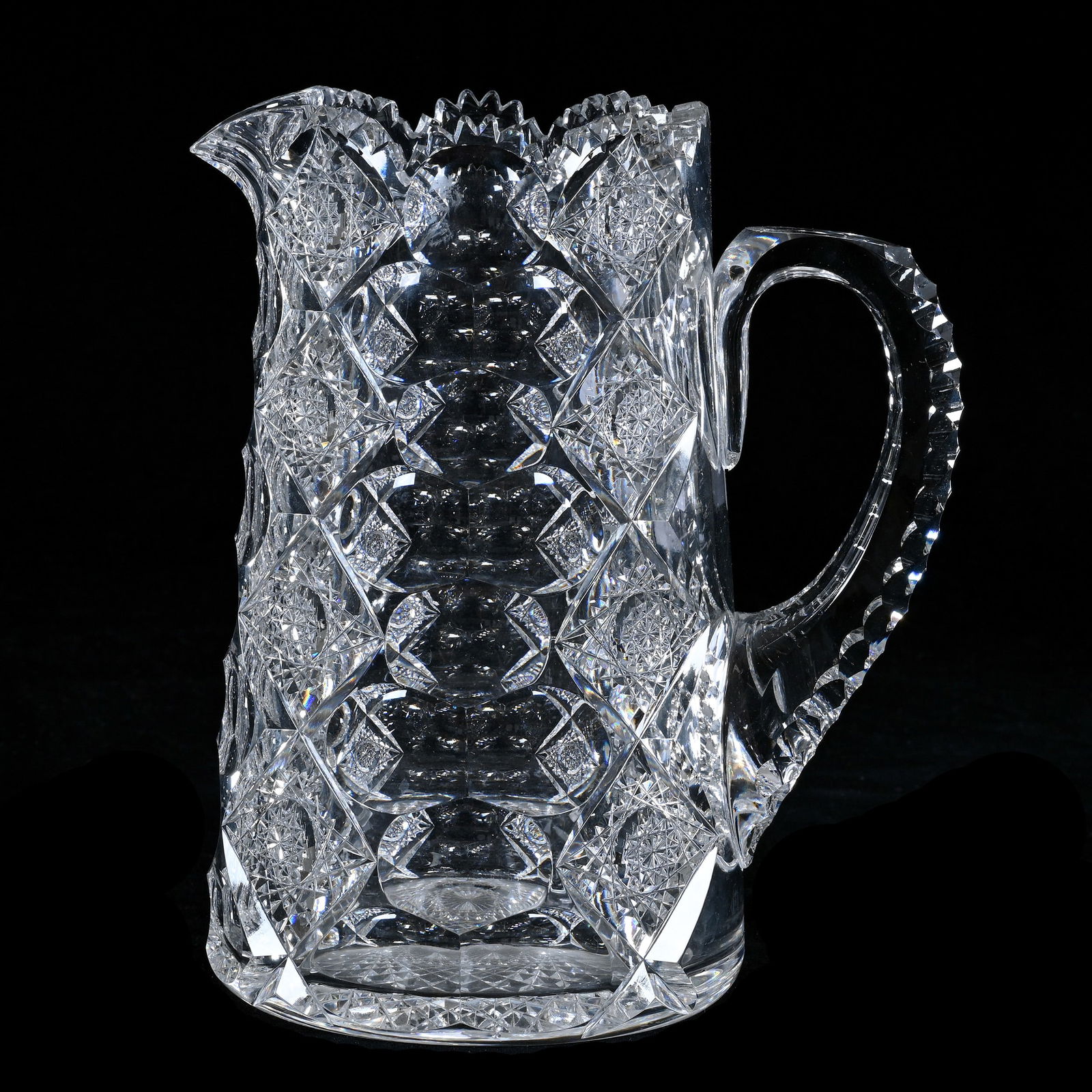 Pitcher, American Brilliant Cut Glass, Signed Hawkes Queens Pattern: Pitcher, American Brilliant Cut Glass, Signed Hawkes Queens Pattern, 8.5 x 7.5 x 5 Inches, Triple Notched Handle, Hobstar Base, 5 Pounds, Pennsylvania Private Collection.