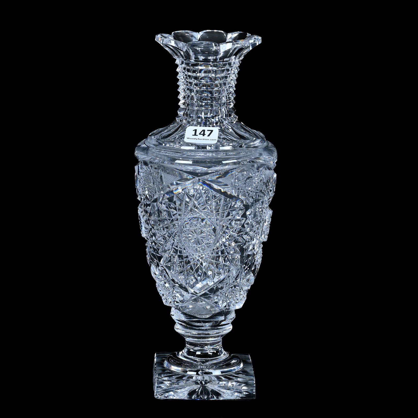 Pedestal Urn Shaped Vase, American Brilliant Cut Glass: Pedestal Urn Shaped Vase, American Brilliant Cut Glass, 10 x 4 x 4 Inches, Hobstar And Crosscutting Motif, Step Cut Neck, Square Ray Cut Foot, Clear Blank, Base Chip, 3.2 Pounds, Bill Sandars Collecti