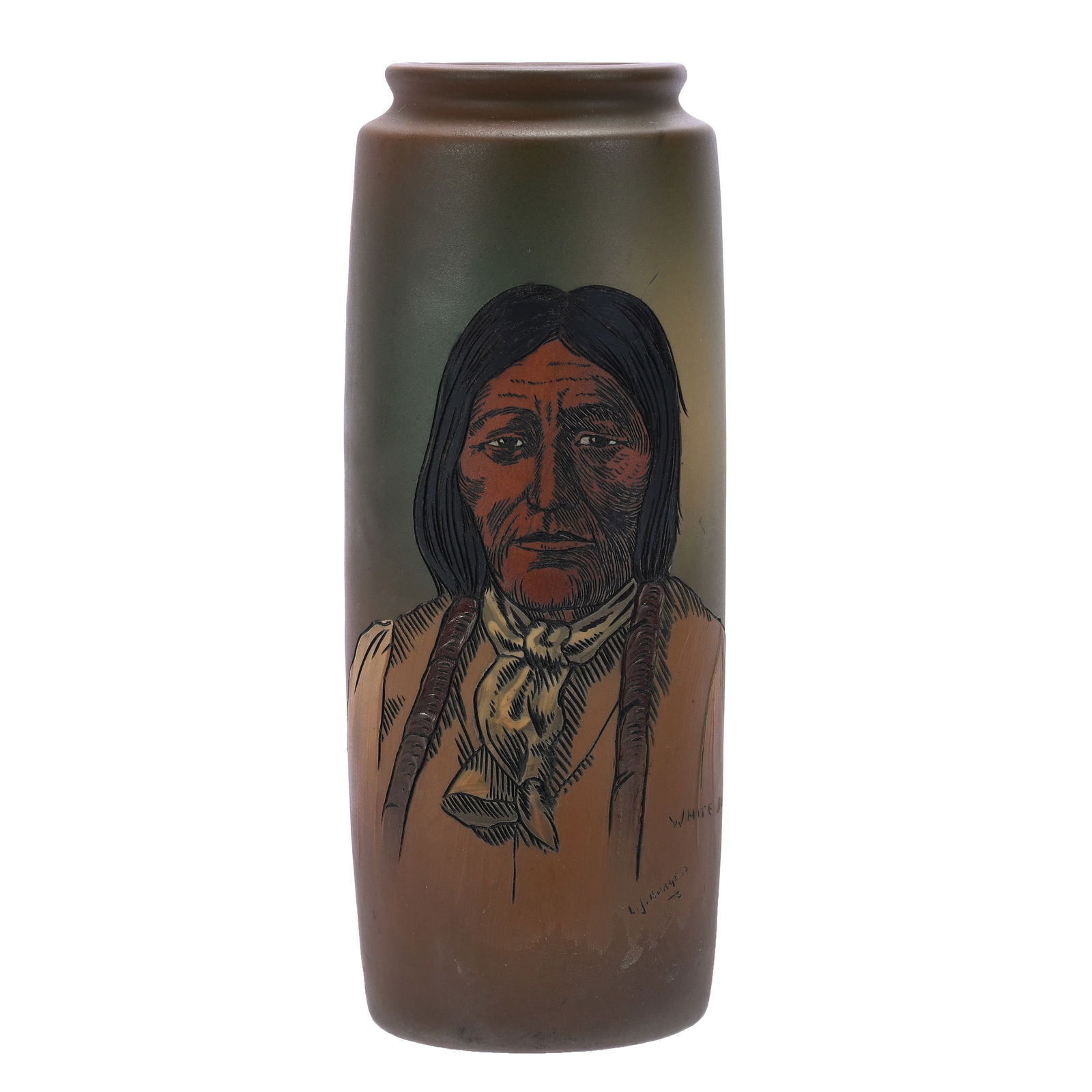 Cylinder Vase, Weller Dickens Ware, Native American Portrait: Cylinder Vase, Weller Dickens Ware, 10.25 x 4 x 4 Inches, Brown And Green Tones With Native American Portrait Of White Buffalo, Artist Signed L.J. Burgess, 2.5 Pounds, Douglas Millhoff Collection, OH.