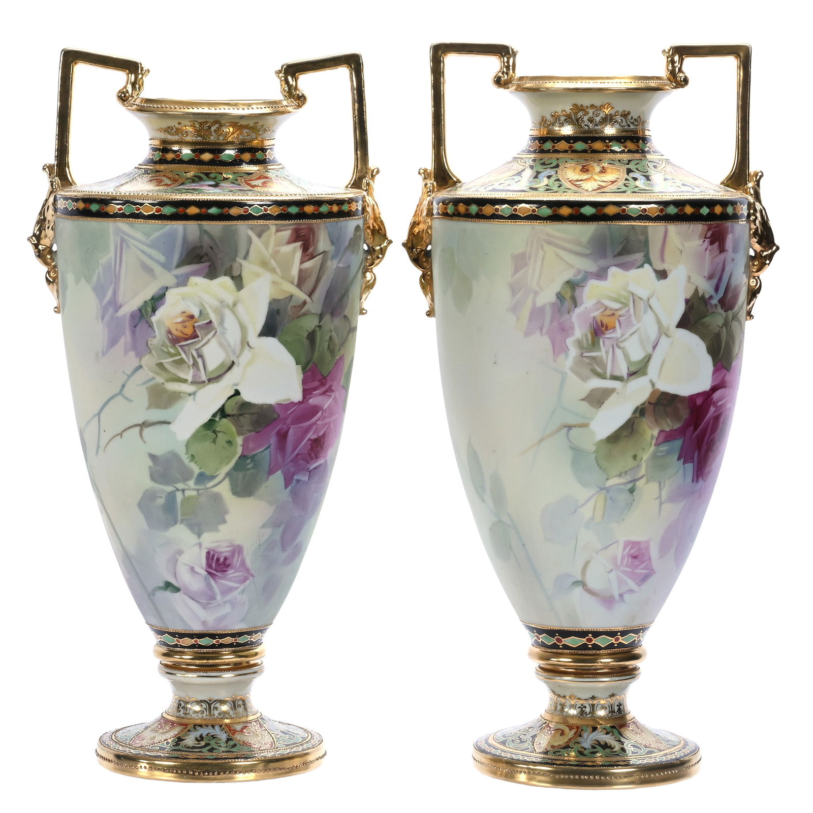 Pair Of Pedestal Two Handled Urns, Marked Nippon: Pair Of Pedestal Two Handled Urns, Marked Nippon, 17.5 x 8.5 x 7.5 Inches, Green And Blue Tones With Pink And White Rose Decor, Black Border With Multi-Colored Shield, Phoenix, Dragon, Diamond, And