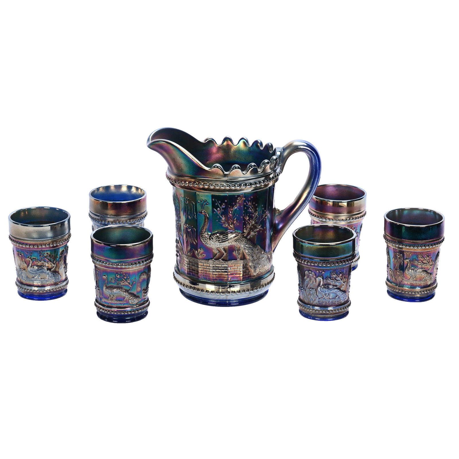 Water Set, Carnival Glass, Peacock At The Fountain Pattern By Northwood: Water Set, Carnival Glass, Peacock At The Fountain Pattern By Northwood, Blue, (1) 8" x 8.25" Water Pitcher With (6) 4" Tumblers, 6.4 Pounds, Darrell and Sandy Schulte Collection, Kansas.