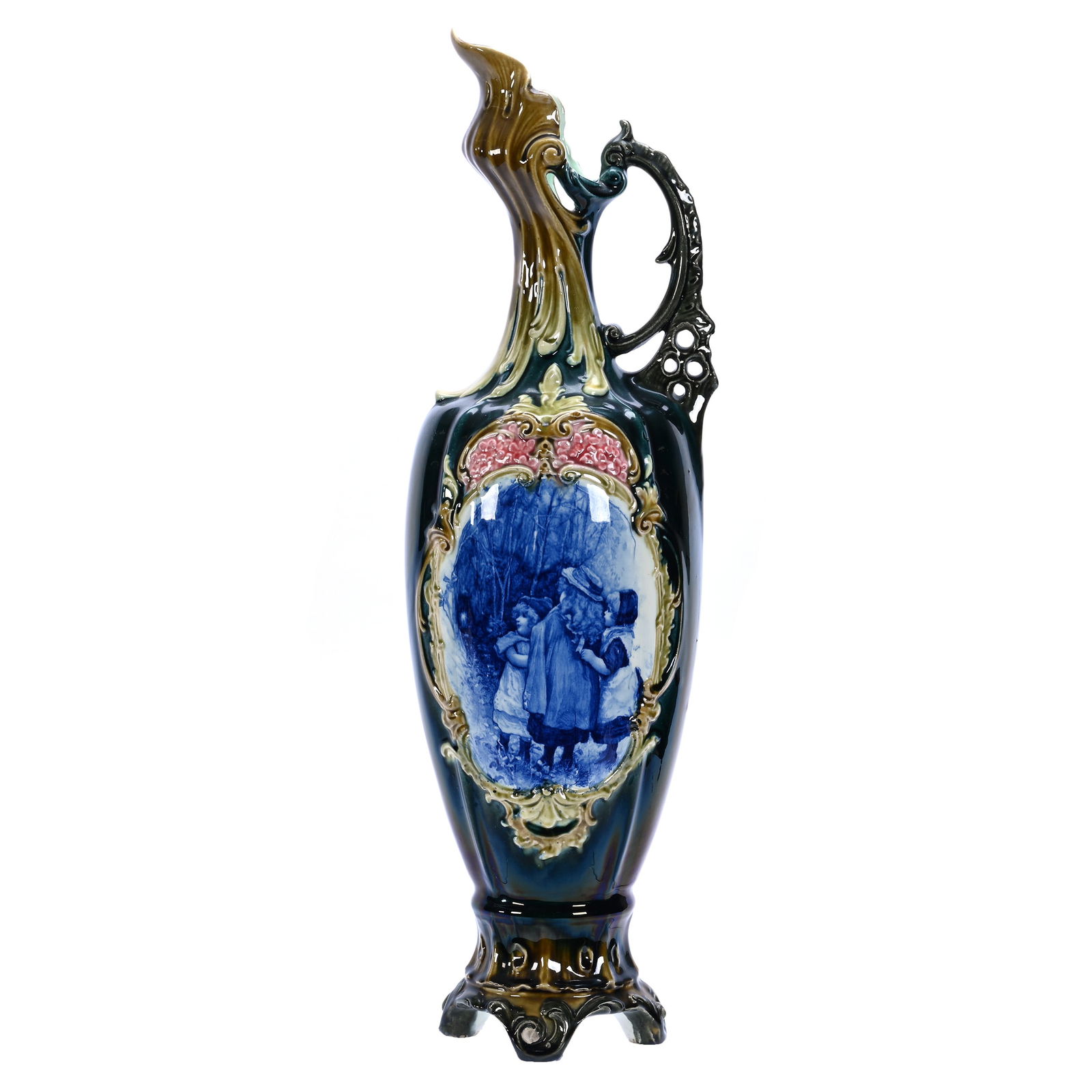 Large Ewer, Unmarked Majolica: Large Ewer, Unmarked Majolica, 23 x 6.5 x 6.5 Inches, Dark Iridescent Green Background With Embossed Scroll Medallion Featuring Babes In Woods Flow Blue Scenic Decor, Minor Edge Nicks On Handle, Base