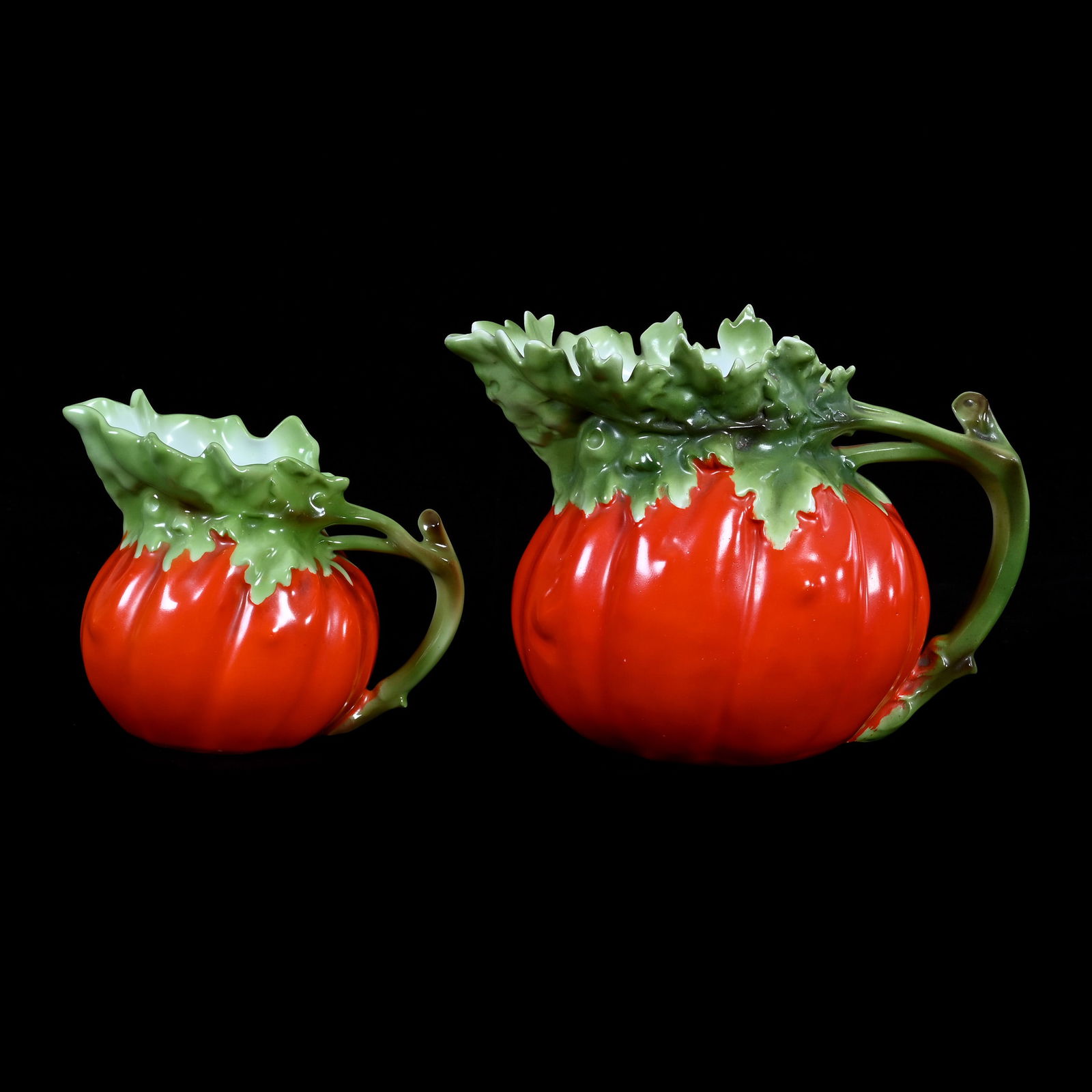 (2) Pitchers Marked Royal Bayreuth, Tomato Shaped: (2) Pitchers Marked Royal Bayreuth, Tomato Shaped, 1) 6" x 8.75" x 5.75 Water Pitcher, Blue Mark, 1) 4.75" x 5.5" x 4" Milk Pitcher, Green Mark, 2.3 Pounds, Private Collection, Kansas.