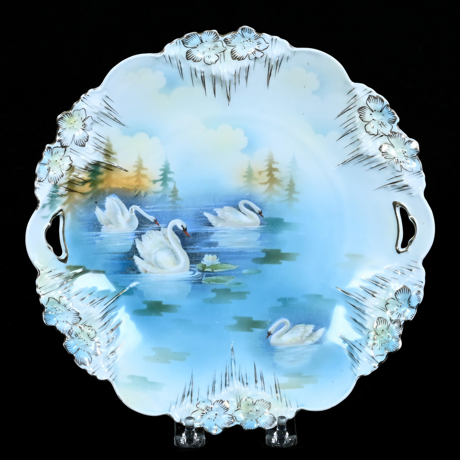 Two Handled Cake Plate, Marked R.S. Prussia, Icicle Mold: Two Handled Cake Plate, Marked R.S. Prussia, Icicle Mold, Swan Scenic Decor, 9.75 x 9.75 x 1.25 Inches, Private Collection, Indiana, 0.9 Pounds. Effective 6/6/26, All LiveAuctioneers Invoices Must Be