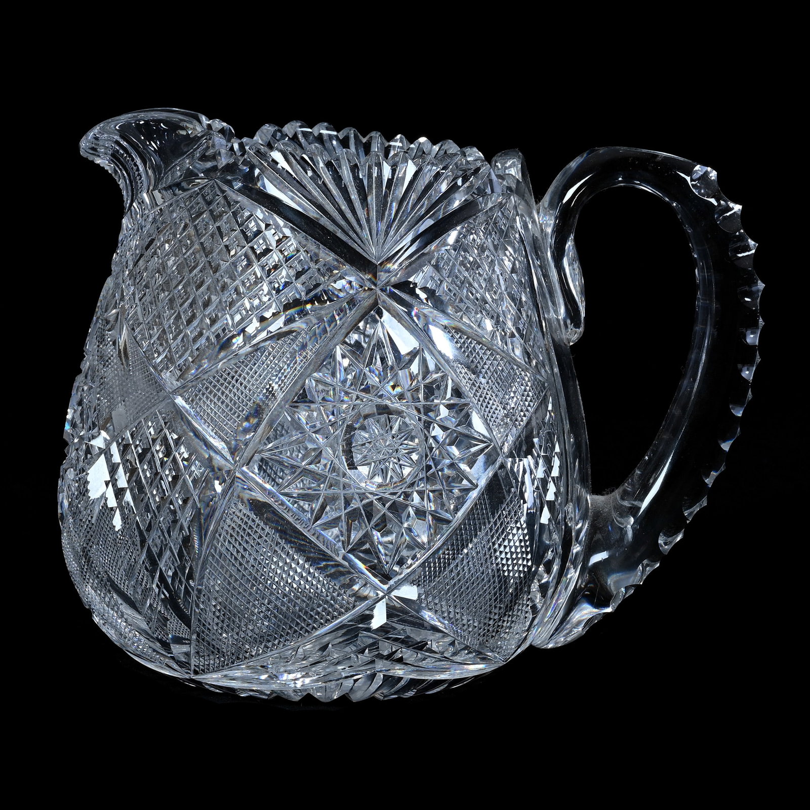 Jug, American Brilliant Cut Glass, Signed Libbey, Corinthian Pattern By Libbey: Jug, American Brilliant Cut Glass, Signed Libbey, Corinthian Pattern, 6.75 x 8.25 x 6.25 Inches, Triple Notched Handle, Ray Cut Base, 4.7 Pounds, William "Bill" Wright Collection, Wisconsin. Effective