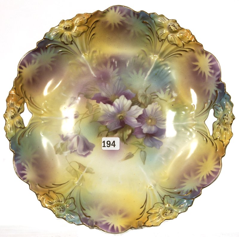 11" UNMARKED PRUSSIA LILY MOLD TWO HANDLE CAKE PLATE: 11" UNMARKED PRUSSIA LILY MOLD TWO HANDLE CAKE PLATE YELLOW, GREEN AND LAVENDER TONES WITH VIOLET DECOR