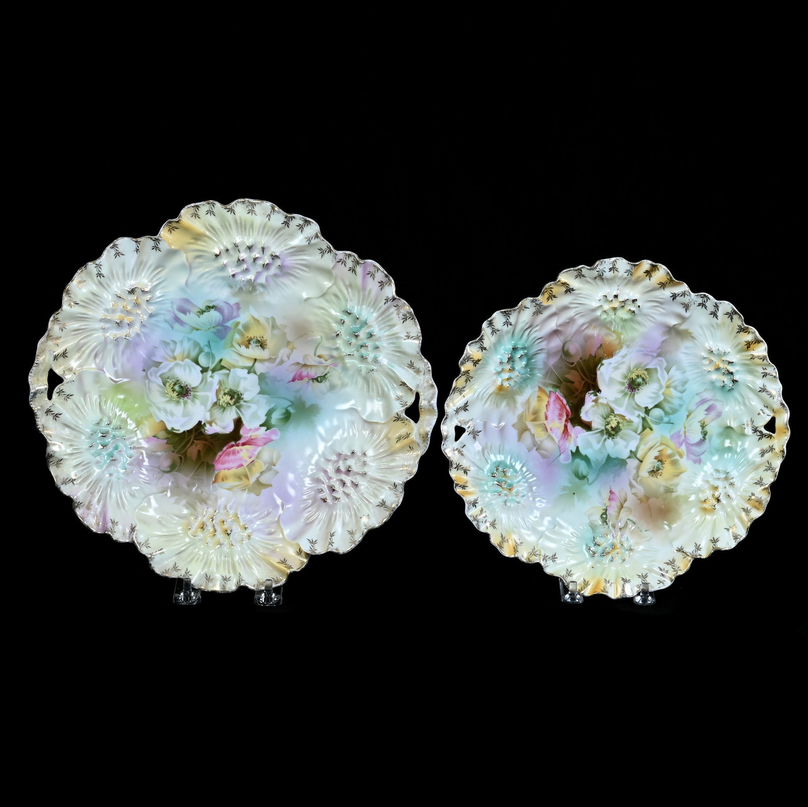 (2) Cake Plates, Marked R.S. Prussia, Sunflower Mold: (2) Cake Plates, Marked R.S. Prussia, Sunflower Mold, 11 x 10.75 x 1.25 Inches, Yellow, Blue, Green, Lavender Tones With White Floral Decor, Smaller Plate Is 9.5", 1.9 Pounds, Grady and Annette Hite