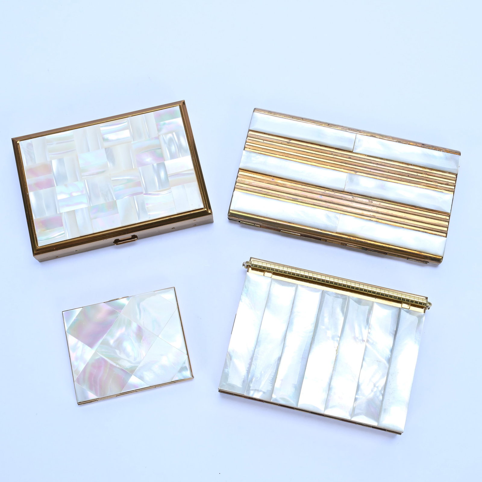 (4) Compacts, Mother Of Pearl Panels: (4) Compacts, Mother Of Pearl Panels, 5.25 x 3 x 1 Inches, Many With Original Contents, Makers Include Elgin, Majestic, Victor Olupte, And One Unmarked, 1.8 Pounds, Grady and Annette Hite Collection,