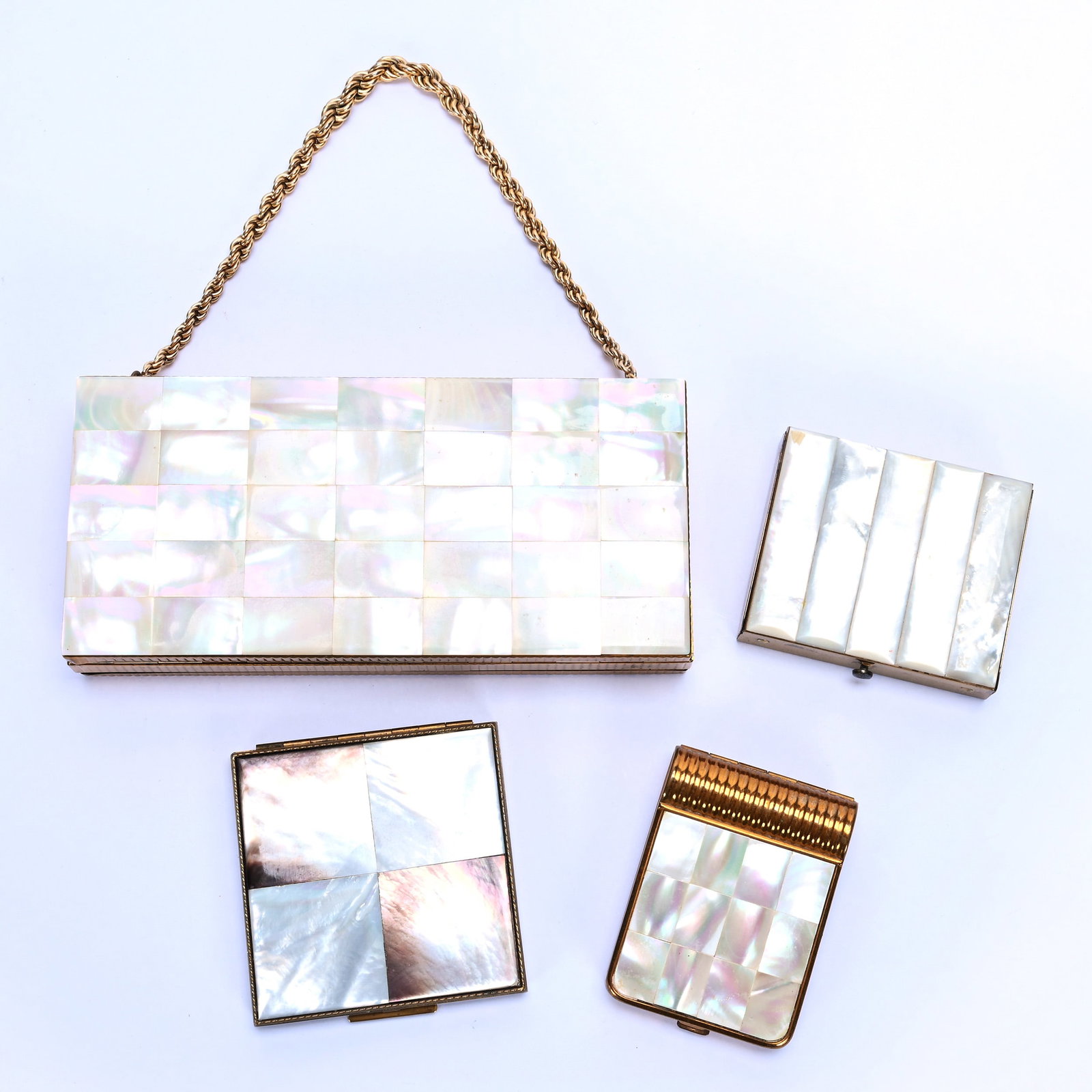 Handbag And (3) Compacts, Mother Of Pearl Panels: Handbag And (3) Compacts, Mother Of Pearl Panels, 6.75 x 3 x 1 Inches, Handbag Marked Evans, (1) Compact Marked Rex Fifth Avenue, (1) Compact Marked Evans, And (1) Unmarked Compact, 2 Pounds, Grady