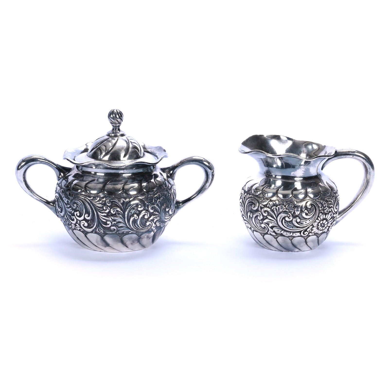 Creamer And Sugar, Marked Meriden Silverplate Model #1994: Creamer And Sugar, Marked Meriden Silverplate Model #1994, 5.5 x 8 x 4.75 Inches, Embossed Scroll And Leaf Design, 1.5 Pounds, Grady and Annette Hite Collection, North Carolina. Effective 6/6/26, All
