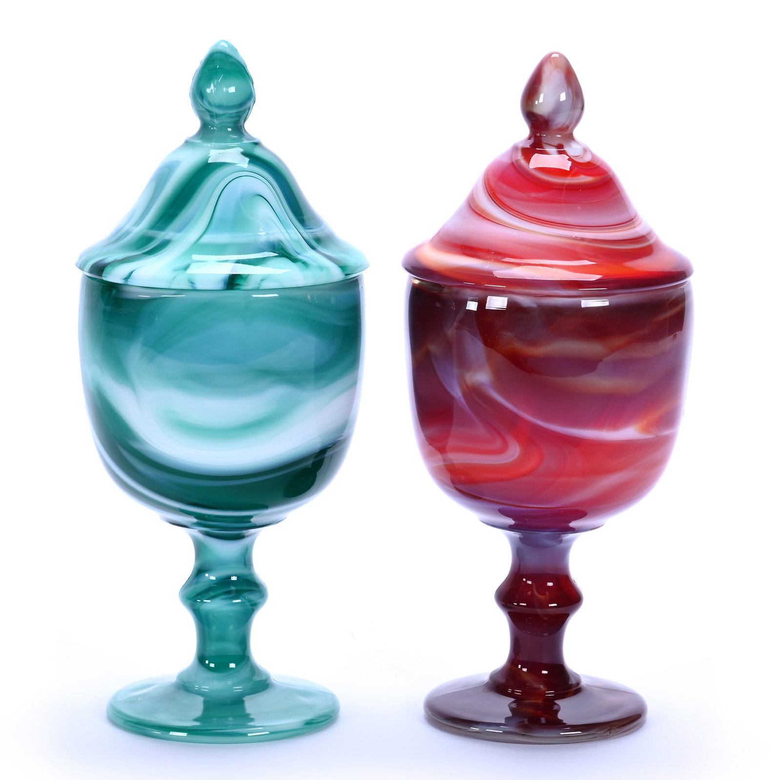 (2) Covered Candy Dishes By Imperial Glass: (2) Covered Candy Dishes By Imperial Glass, 9.25 x 4 x 4 Inches, (1) Green Slag And (1) Red Slag, Circa 1975, 3.5 Pounds, Private Collection, Missouri. Effective 6/6/26, All LiveAuctioneers Invoices M
