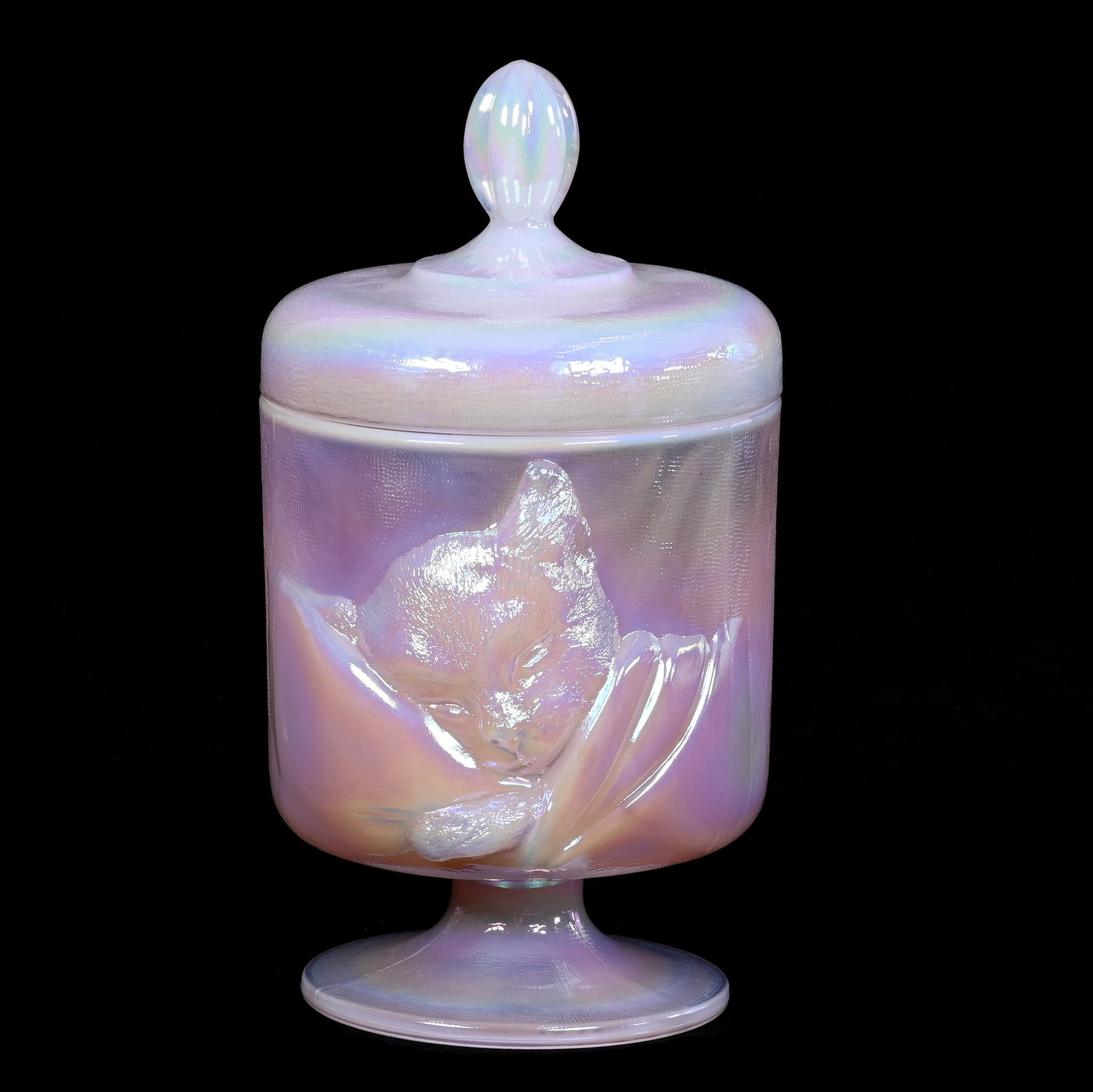 Pedestal Covered Candy Dish, Fenton Iridescent Pink Opal: Pedestal Covered Candy Dish, Fenton Iridescent Pink Opal, 8 x 4.5 x 4.5 Inches, Chessie Cat Pattern, Dated 1990, 2.7 Pounds, Private Collection, Missouri. Effective 6/6/26, All LiveAuctioneers Invoice
