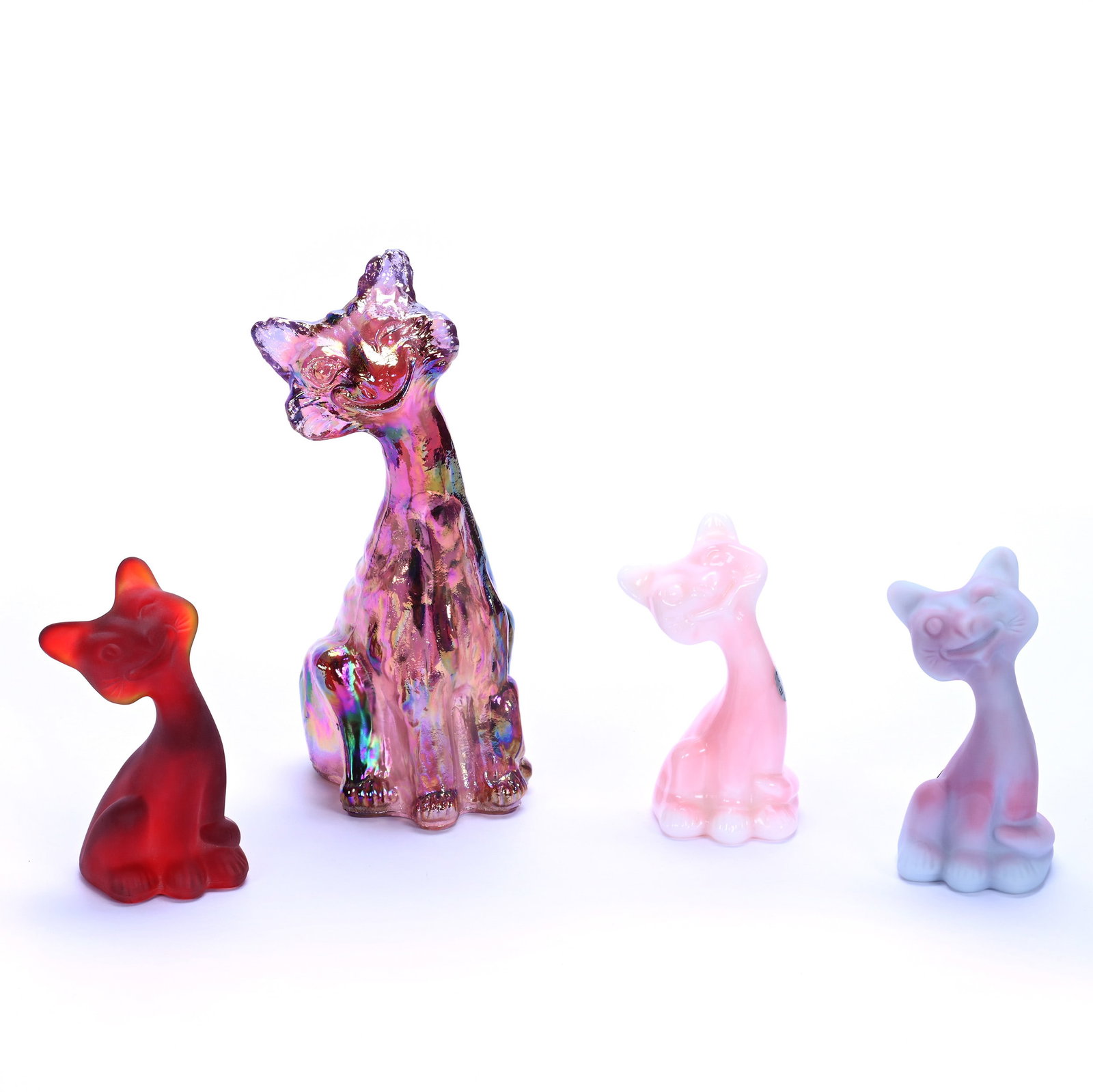 (4) Alley Cat Figures By Fenton (Also Known As Winking/Smiley Cat): (4) Alley Cat Figures By Fenton (Also Known As Winking/Smiley Cat) , 10.75 x 5.5 x 4 Inches, (1) Iridescent Pink, (1) 6" Cat Marked FAGCA (Fenton Art Glass Collectors Of America) , Rosaline Glossy, (1