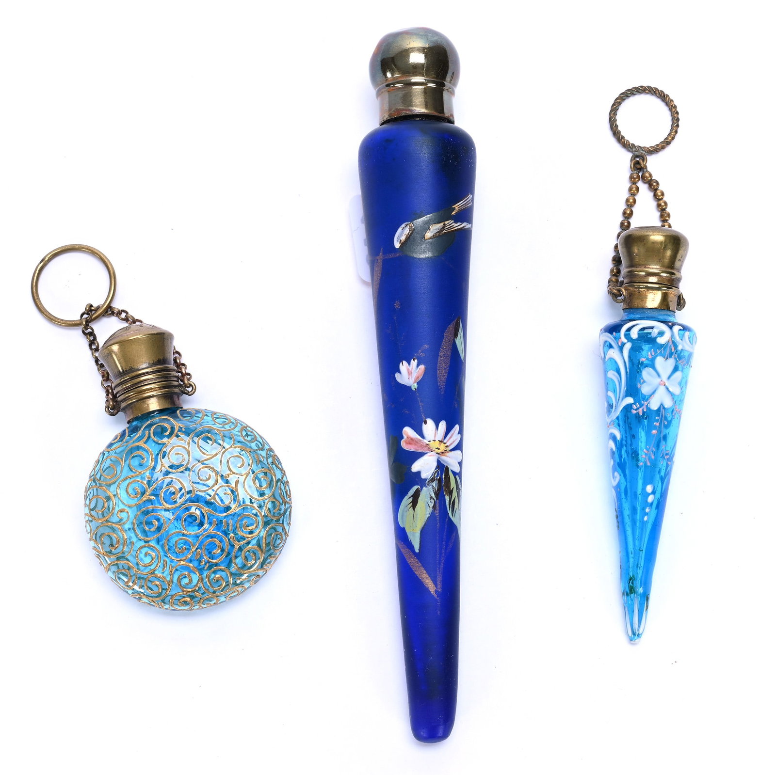 (3) Perfume Bottles: (3) Perfume Bottles, 6.75 x 1 x 1 Inches, (1) Frosted Cobalt Blue With Enamel Bird And Floral Decor, Appears To Have A Repair, (1) 3.75" Blue Art Glass With White Enamel Floral And Scroll Decor, And (