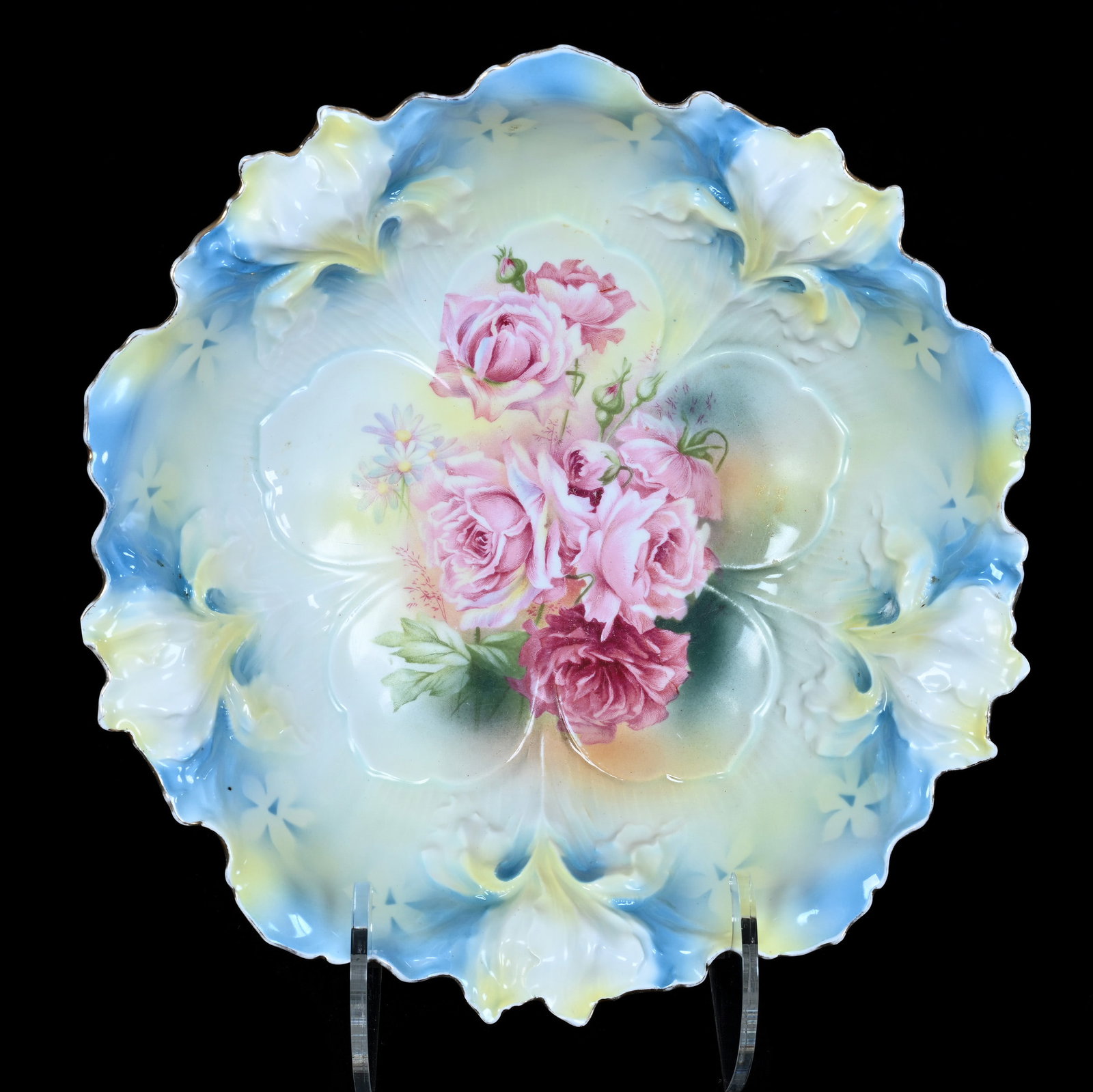 Bowl, Marked R.S. Prussia, Iris Mold: Bowl, Marked R.S. Prussia, Iris Mold, 10.5 x 10.5 x 3 Inches, Blue And Yellow Tones With Pink Rose Decor, Glaze Rim Touchup, 1.2 Pounds, Private Collection, Kansas. Effective 6/6/26, All LiveAuctionee