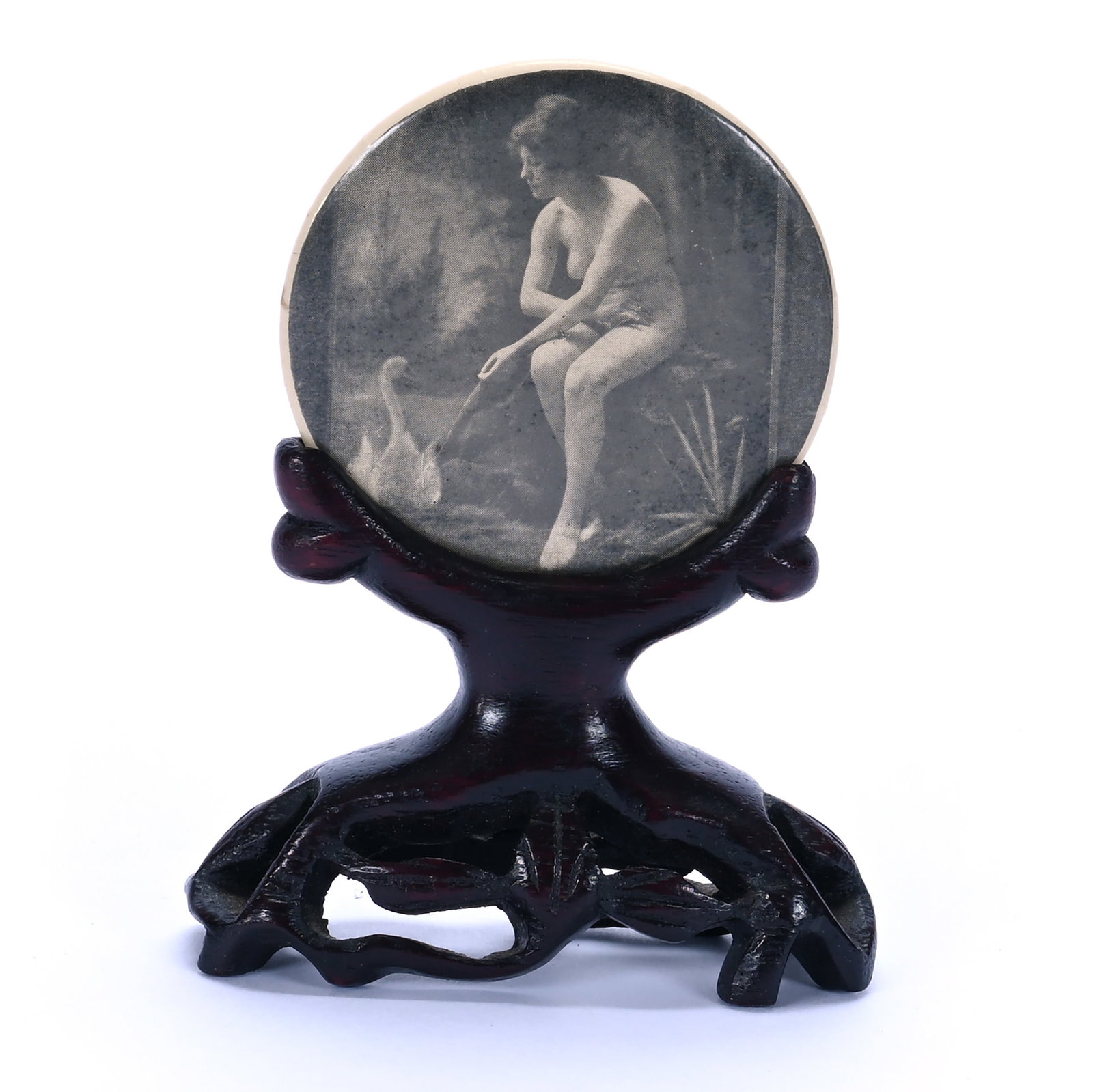 Pocket Mirror On Teakwood Stand: Pocket Mirror On Teakwood Stand, 3.5 x 2.75 x 1 Inches, Monotone Celluloid Featuring Nude And Swan Attributed To Chavas, 0.1 Pounds, Grady and Annette Hite Collection, North Carolina. Effective 6/6/26