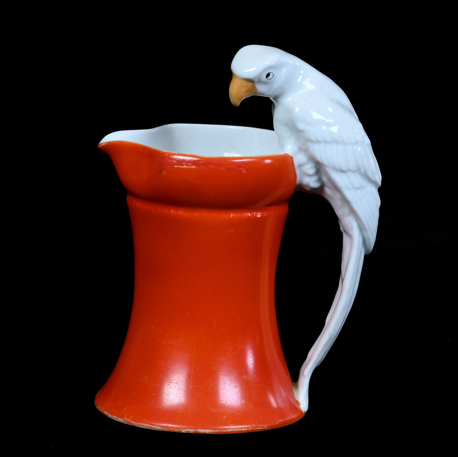 Milk Pitcher, Royal Bayreuth Blue Mark: Milk Pitcher, Royal Bayreuth Blue Mark, 6.5 x 5 x 3.75 Inches, Red Body, With Figural White Parrot Handle, 0.8 Pounds, Private Collection, Michigan. Effective 6/6/26, All LiveAuctioneers Invoices Must