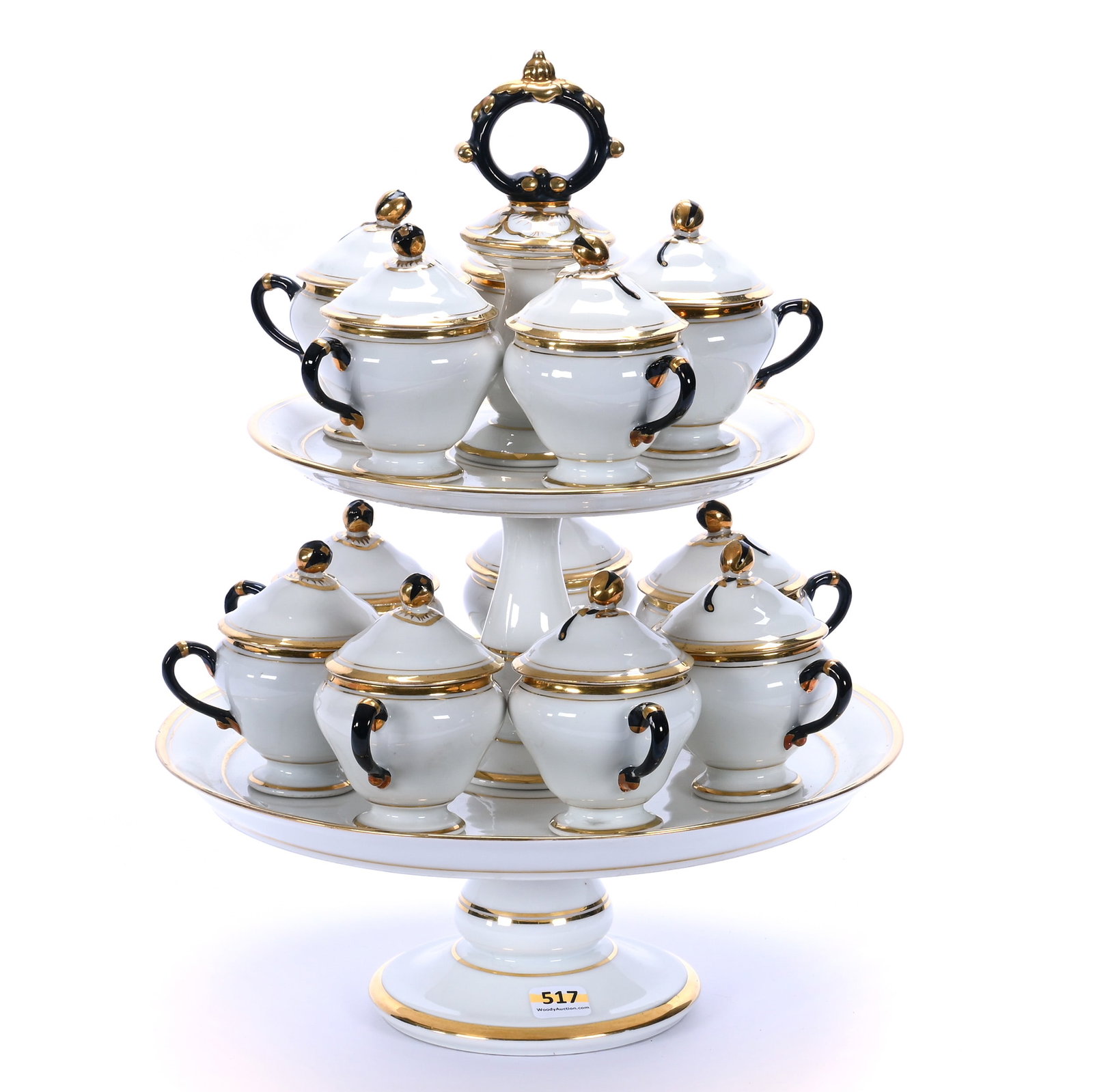 Two Tiered Dessert Stand With (12) Matching Pot De Creme Cups, Unmarked Old Paris Porcelain: Two Tiered Dessert Stand With (12) Matching Pot De Creme Cups, Unmarked Old Paris Porcelain, 14.75 x 11.5 x 11.5 Inches, White With Gold And Black Accents, Circa 1850s, One Rim Chip On Lower Tier Tray